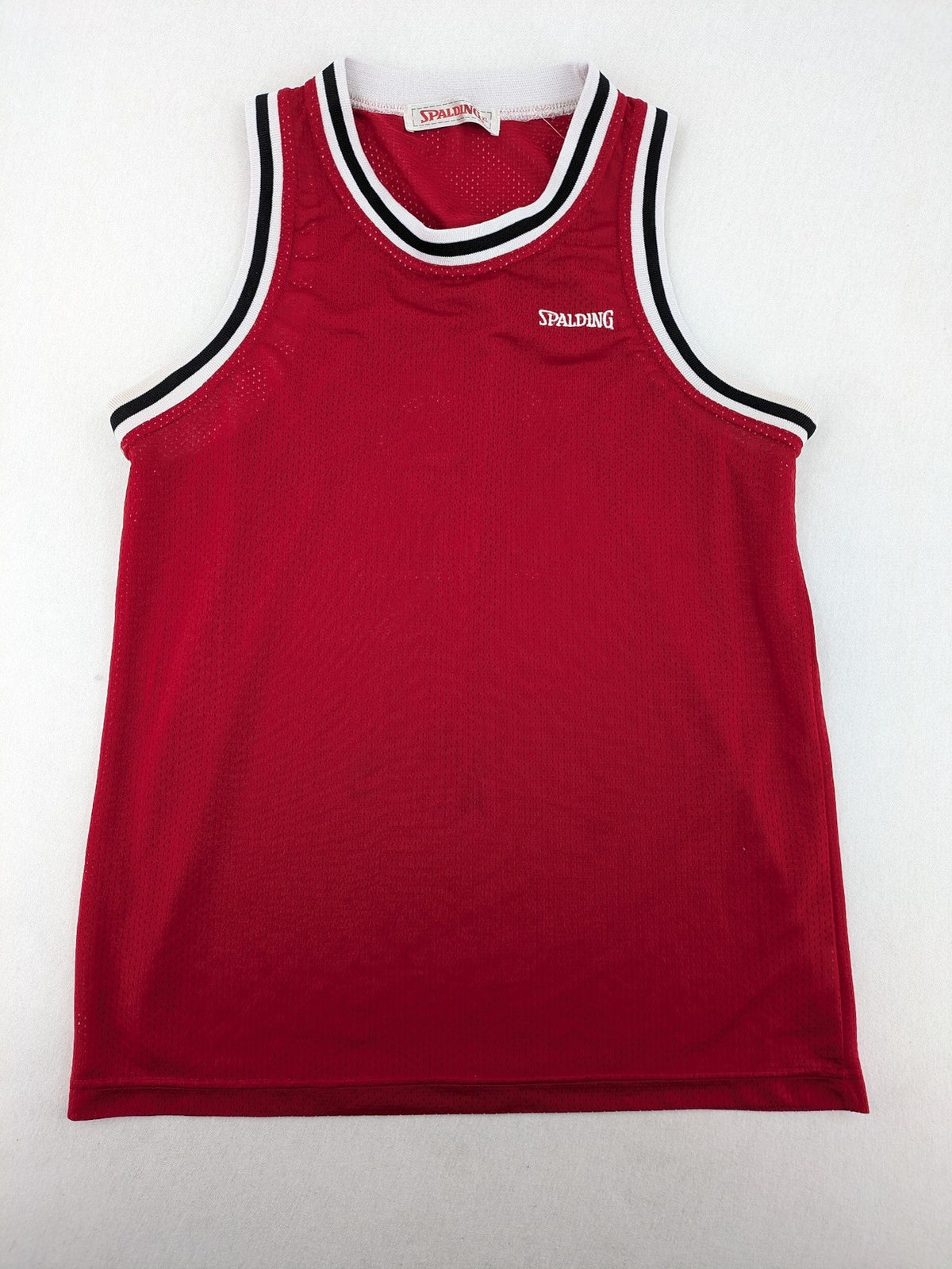 Spalding vintage red basketball jersey size XL, number 11, with black and white striped trim.
