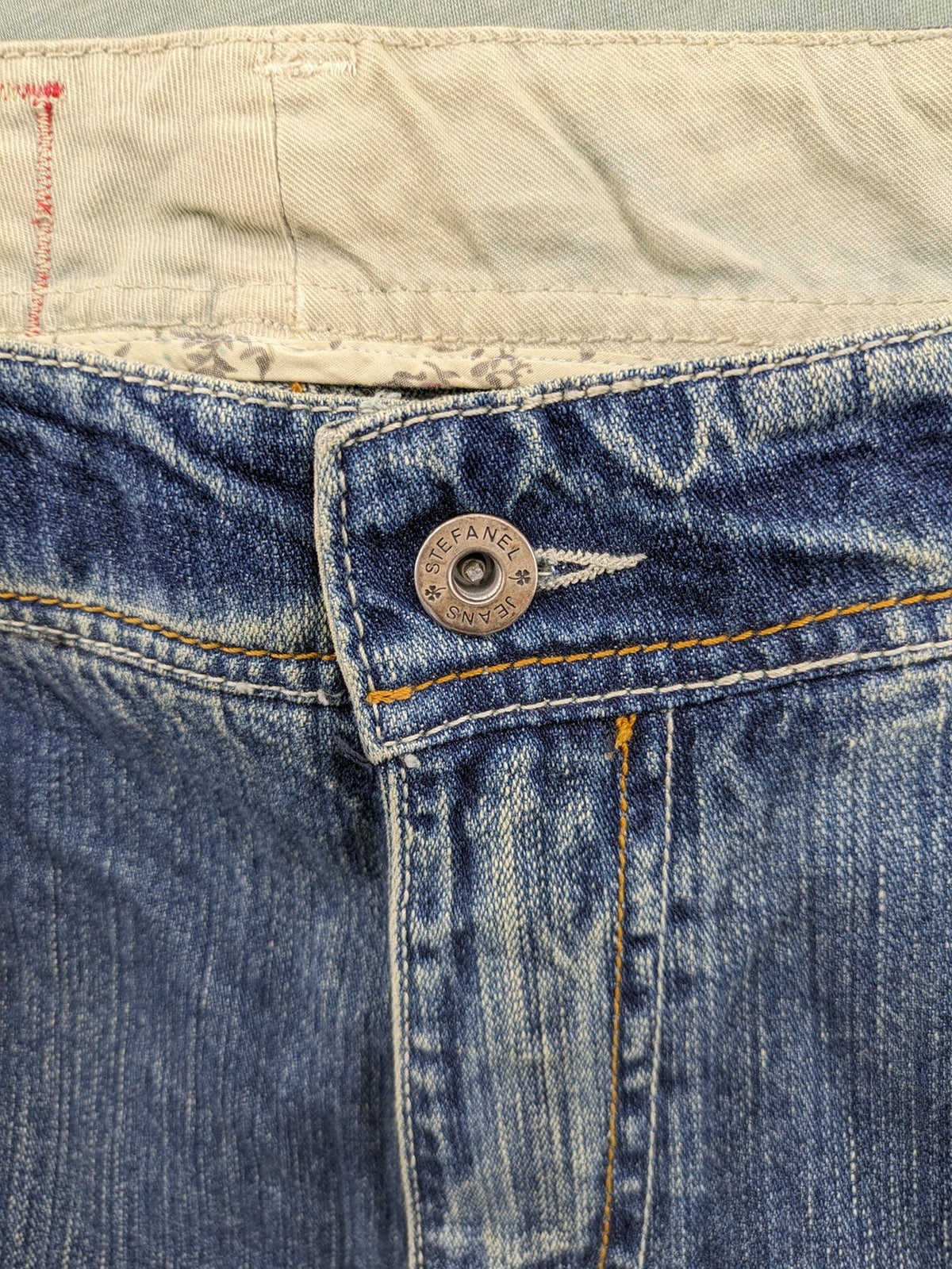 Stefanel blue straight jeans with cuffed hem and classic 5-pocket design.