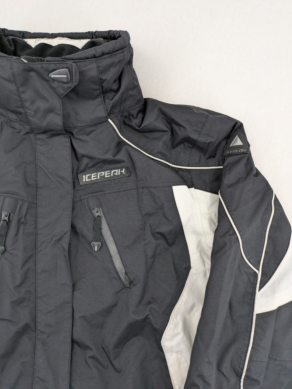 Icepeak black and white ski snowboard jacket with RECCO logo and quilted insulation.