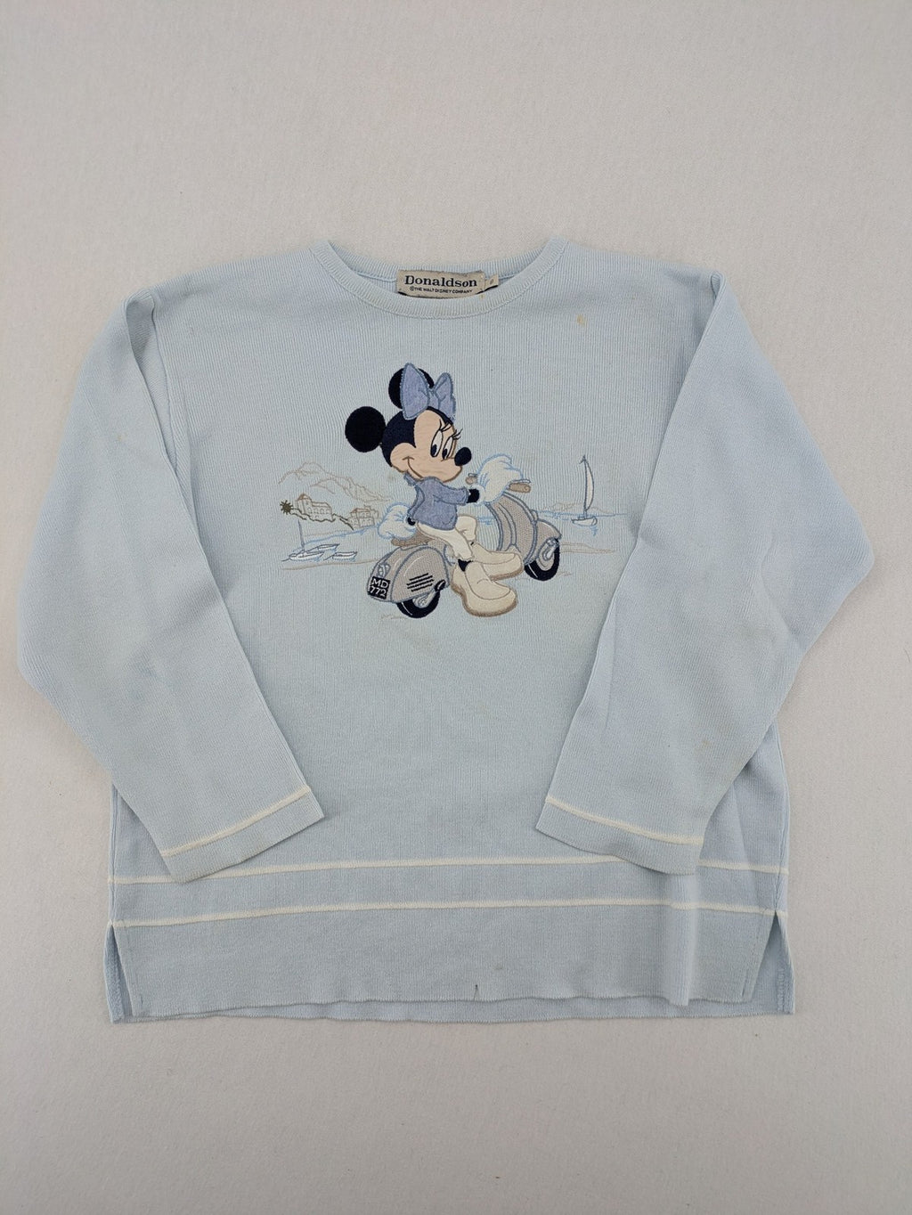 Donaldson multi turtle neck jumper light blue with embroidered Minnie Mouse graphic and ribbed texture.