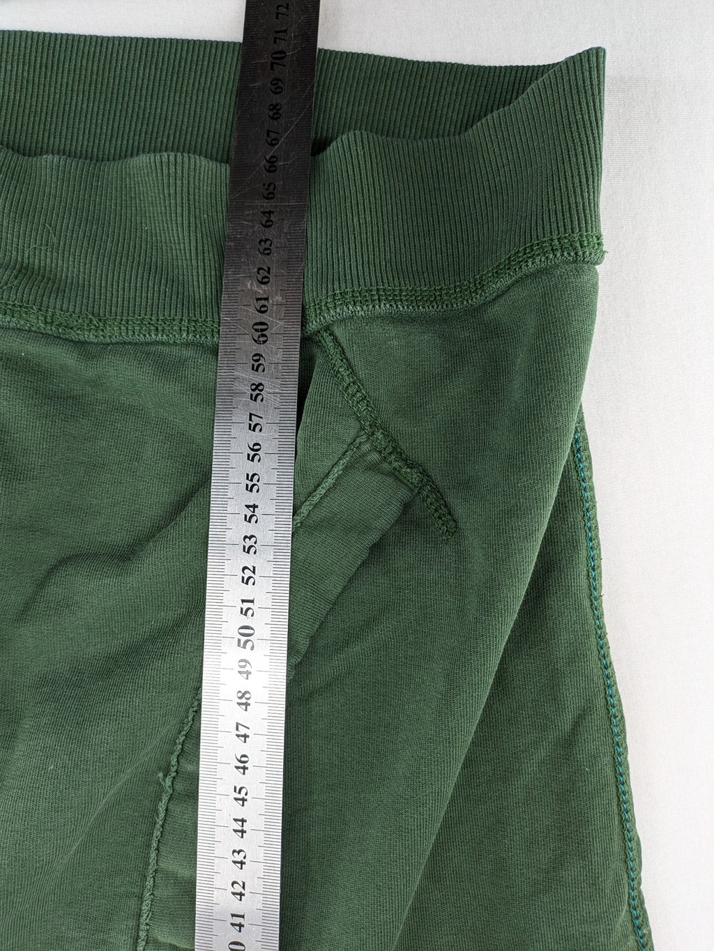 Tommy Hilfiger Denim green hoodie full zip with large graphic logo and grey waffle lining.