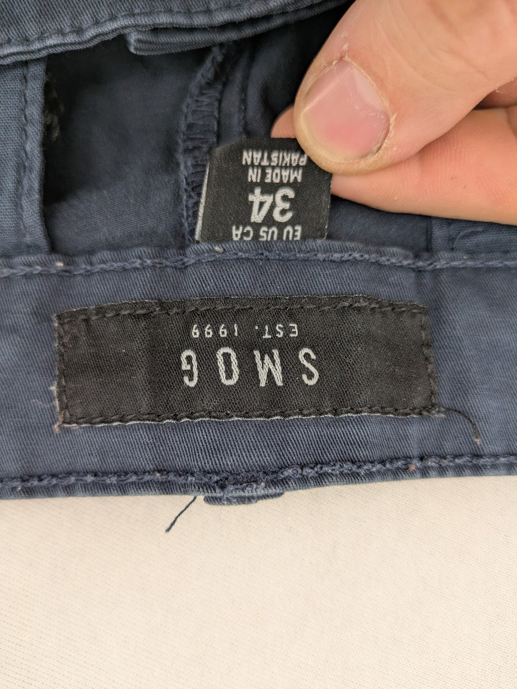 smog blue chino pants with belt loops, button fly, and side pockets