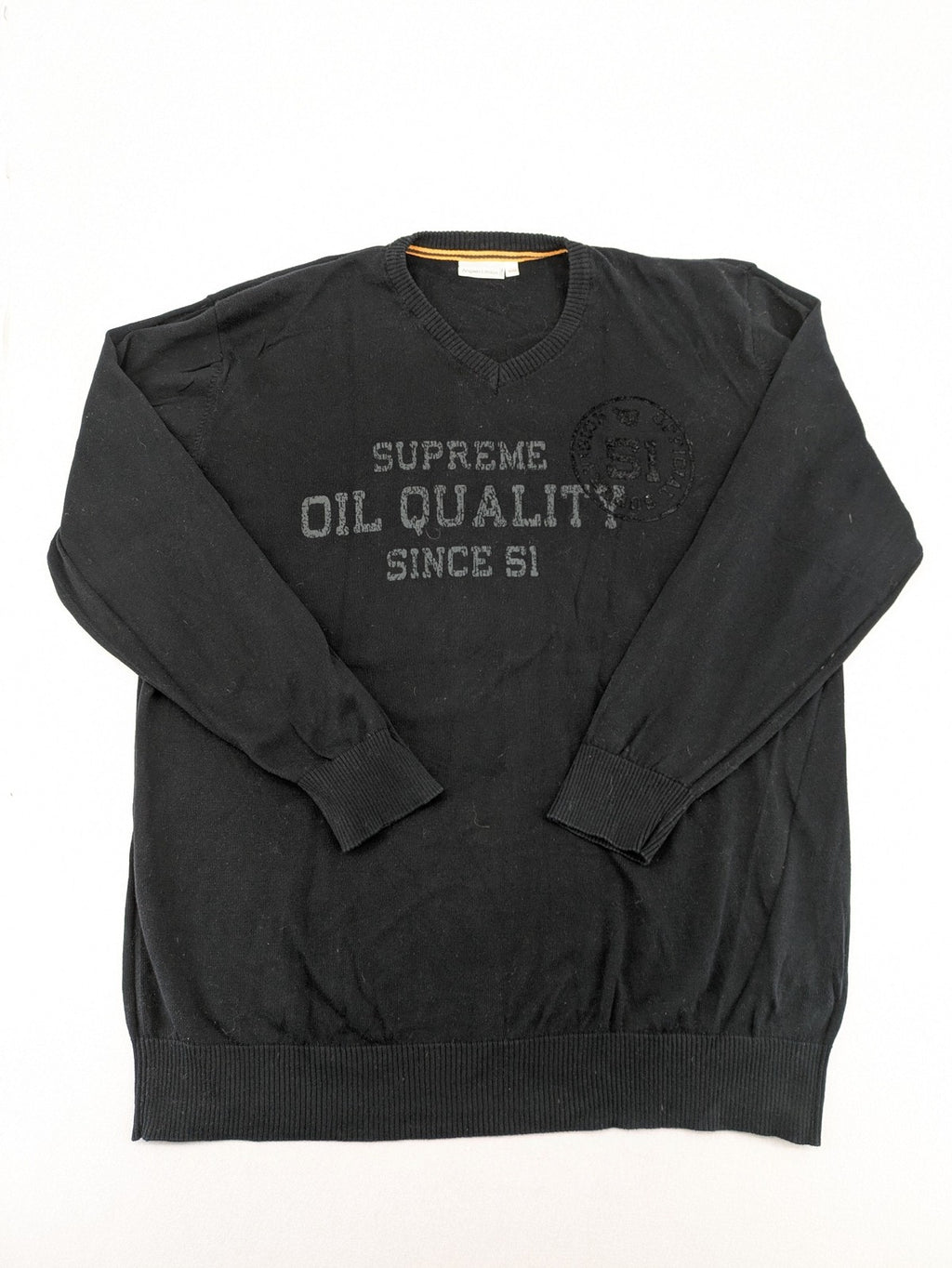 Angelo Litrico black knit jumper V-neck with tonal emblem and "Supreme Oil Quality" graphic.