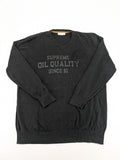 Angelo Litrico black knit jumper V-neck with tonal emblem and "Supreme Oil Quality" graphic.