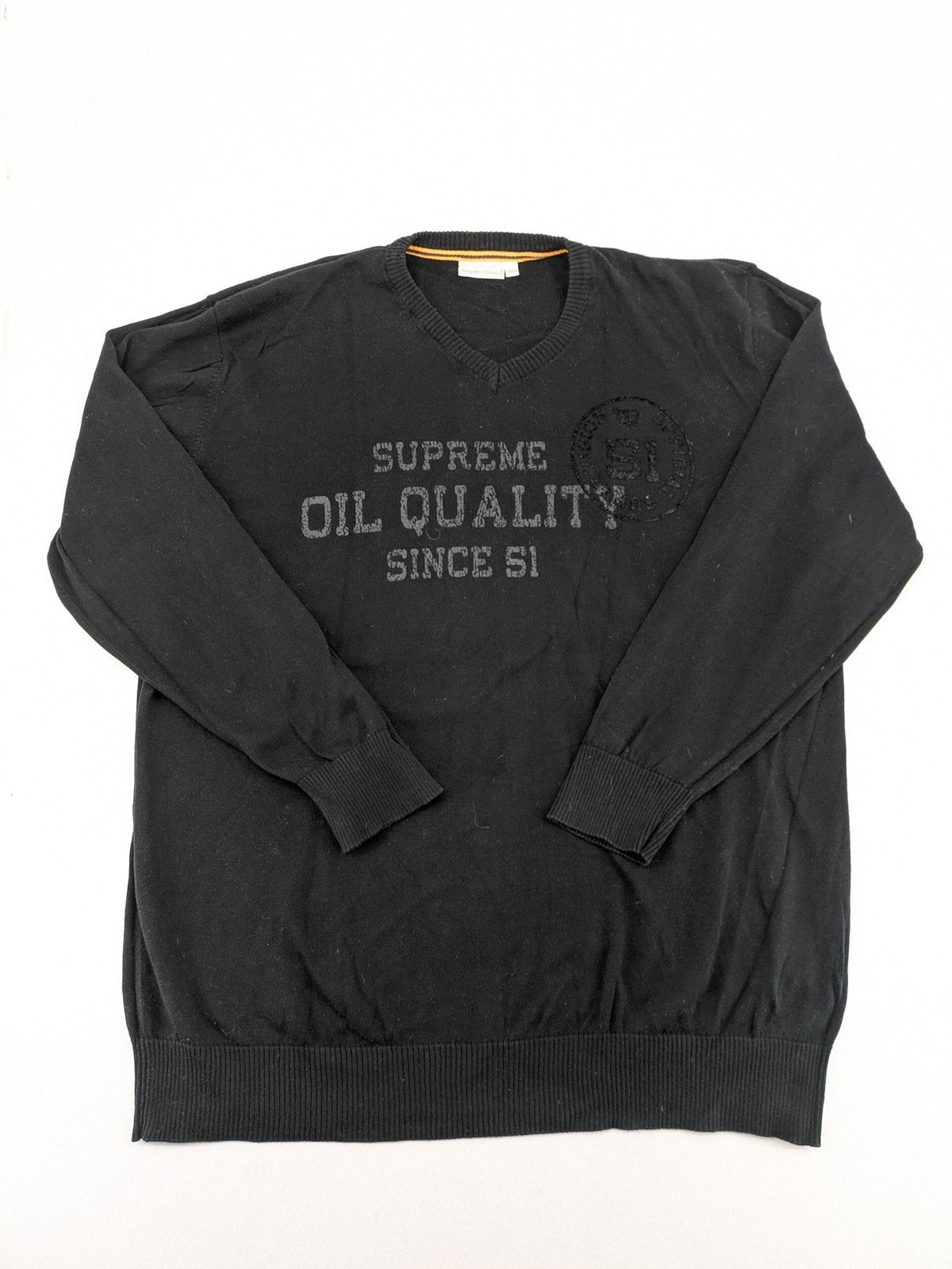 Angelo Litrico black knit jumper V-neck with tonal emblem and "Supreme Oil Quality" graphic.