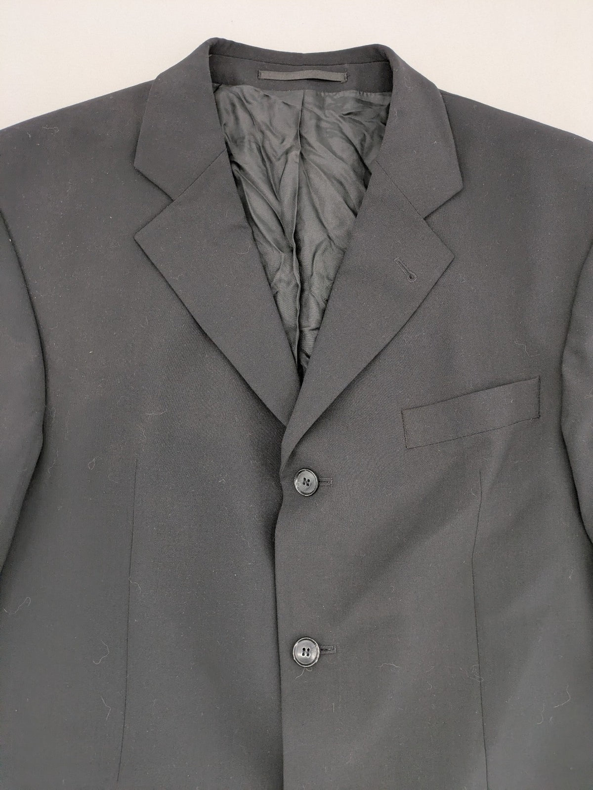 Jake*s pink jacket classic design with falling lapel and three-button closure.