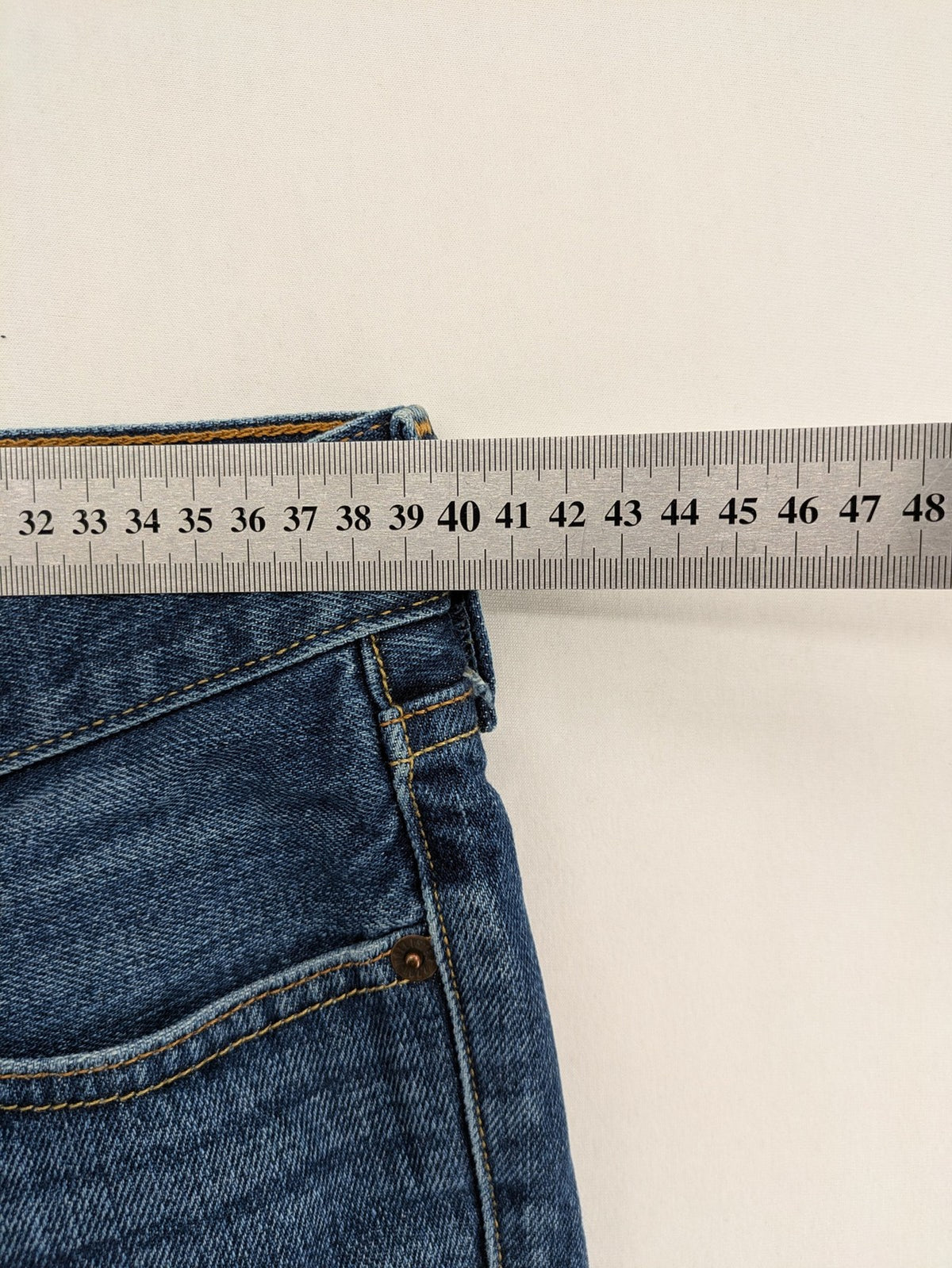Hollister blue super skinny jeans medium wash button fly with faded details.