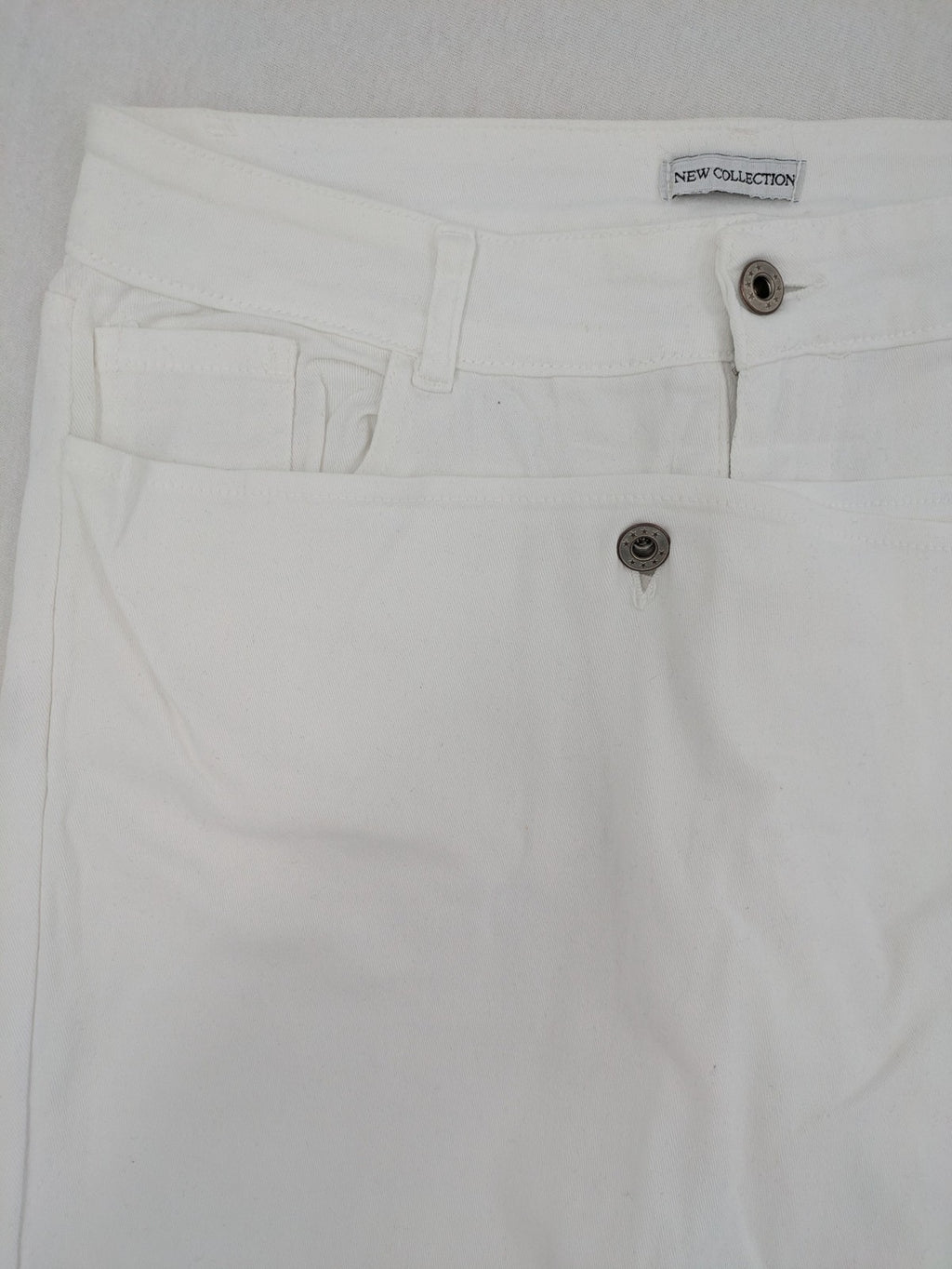 New Collection white straight jeans asymmetrical wrap design with side lacing and cotton-stretch material.