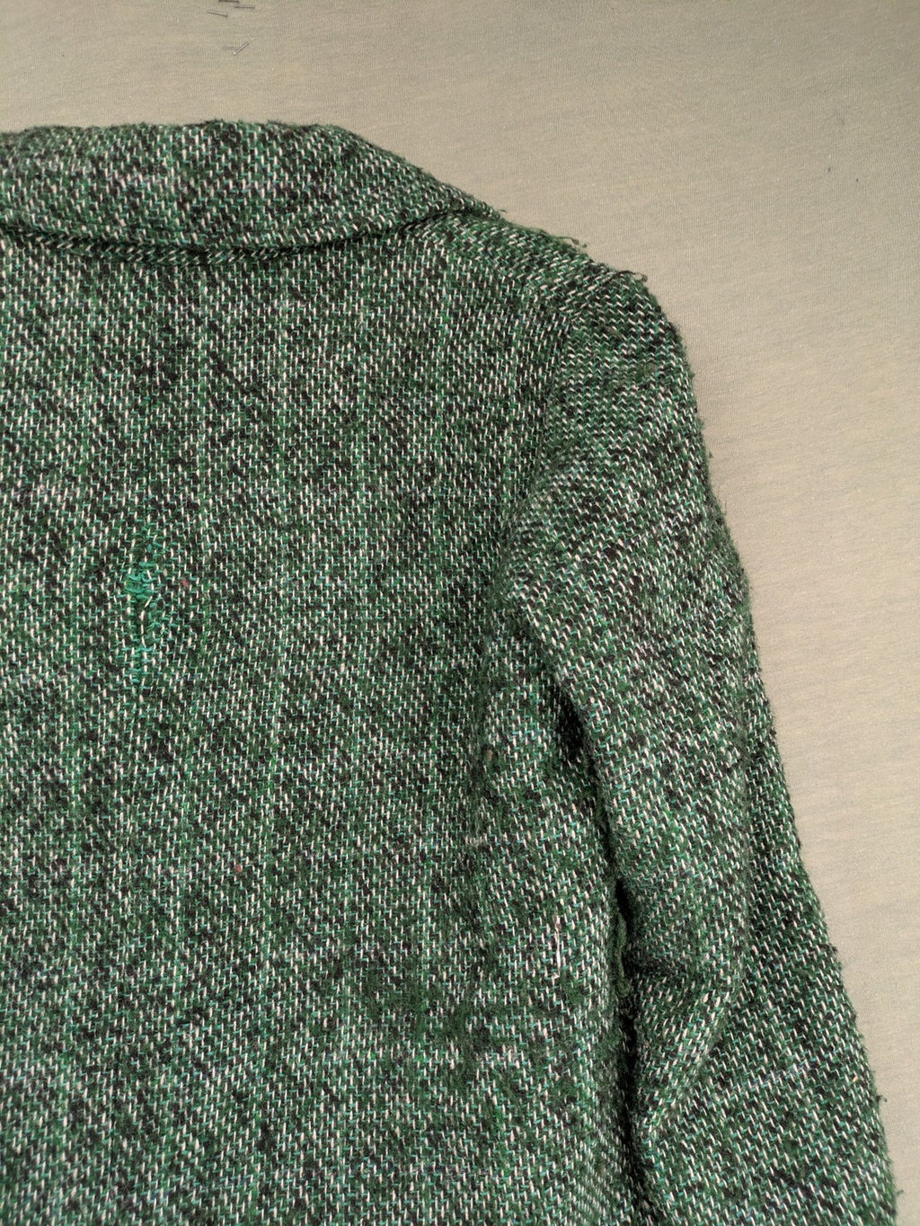 Esprit green black white tweed coat with notch collar and three-button closure.