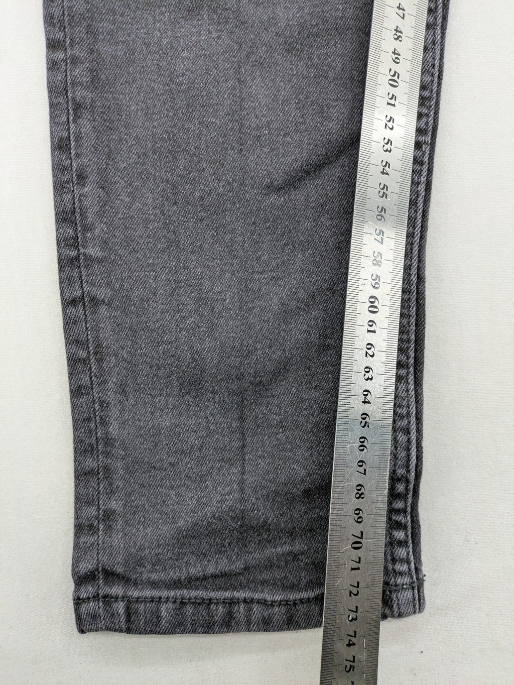 Zara black straight jeans faded wash five-pocket design with zipper closure.