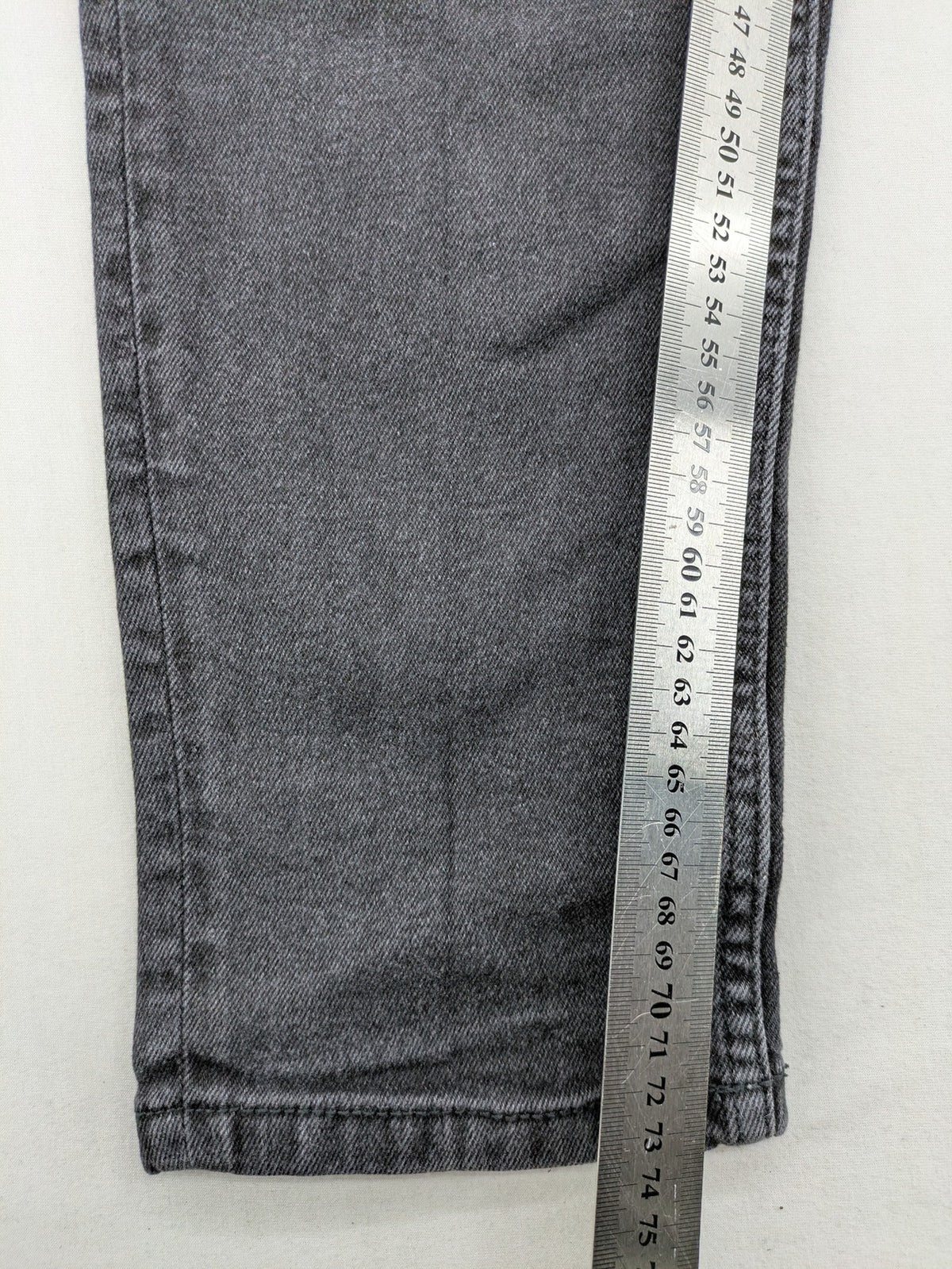Zara black straight jeans faded wash five-pocket design with zipper closure.