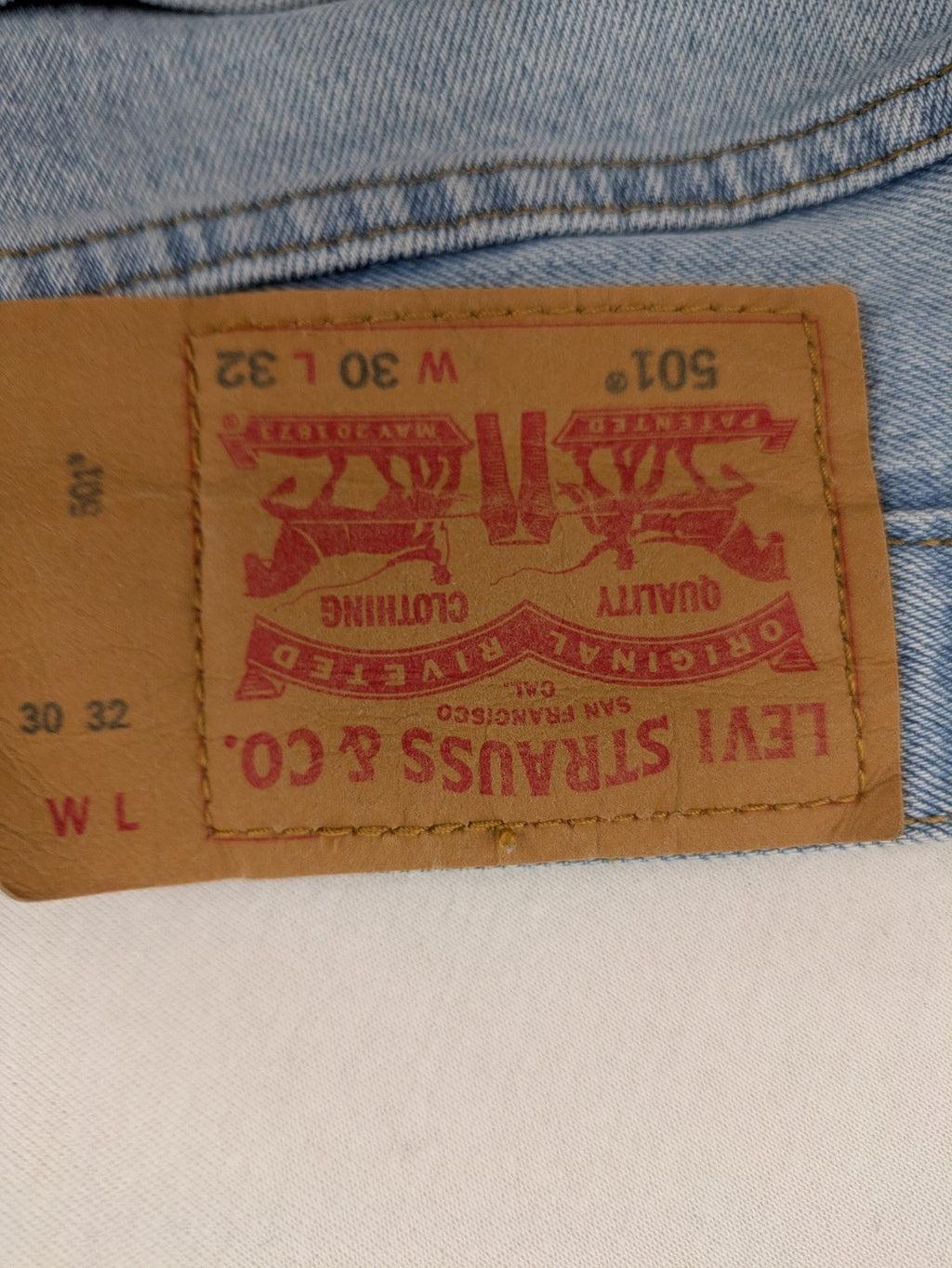 Levi's blue straight jeans light wash denim with button fly and classic fit.