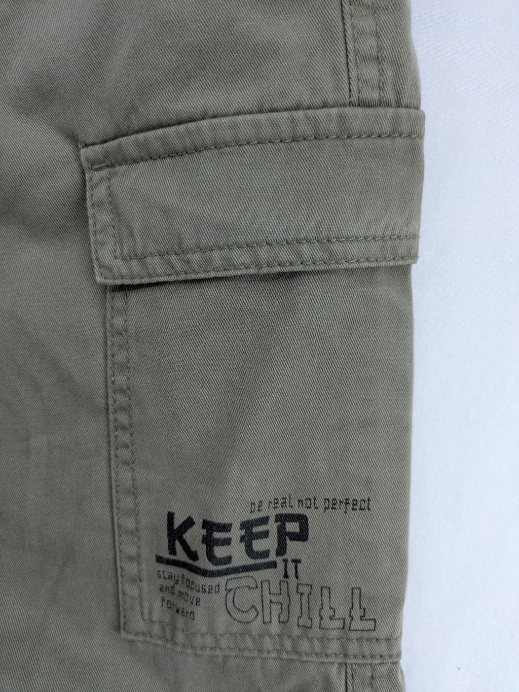 Y.F.K. khaki cargo pants with elastic cuffs, side pockets, and drawstring waistband.