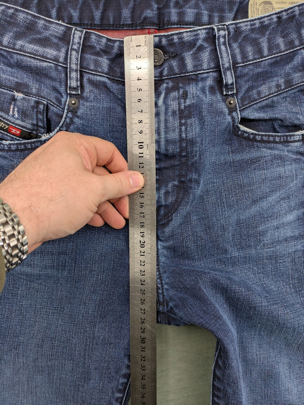 Diesel blue boyfriend jeans low waist dark wash stretch denim with logo patch.