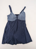 Muster blue one-piece swimsuit with geometric pattern and adjustable straps.