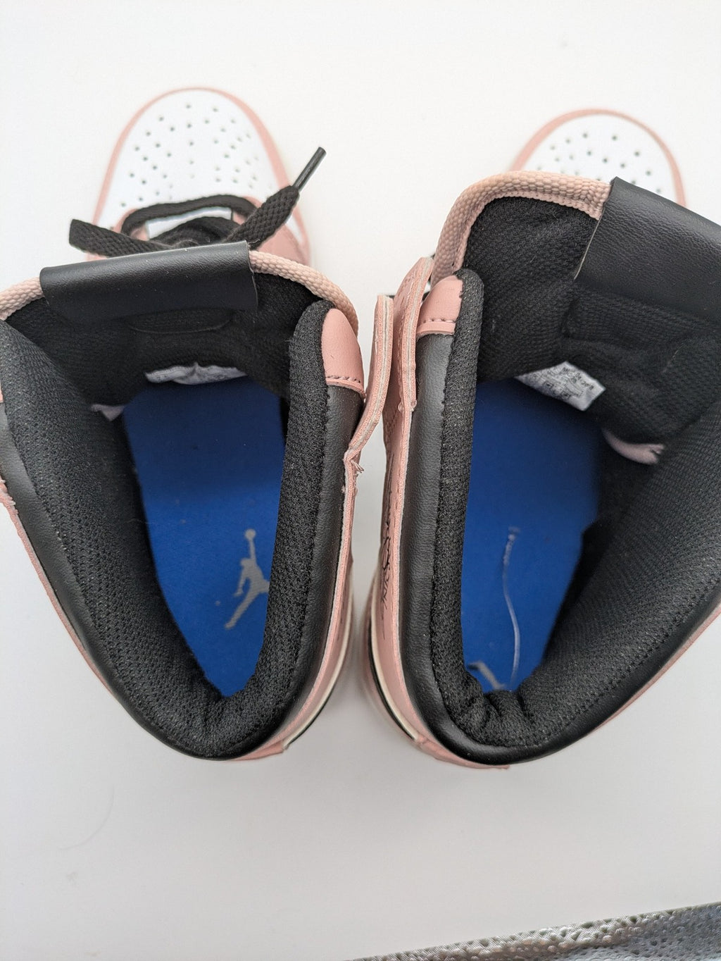 Nike Air Jordan high-top sneakers multi with Wings logo, Jumpman detail, and perforated toe.