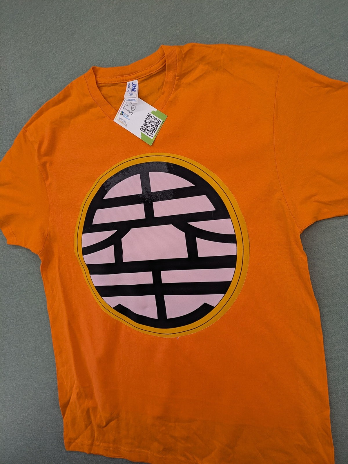 Dragon Ball Z orange t-shirt featuring 'Go' kanji symbol, made of soft cotton.
