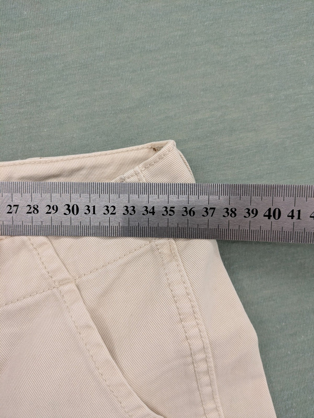 MNG beige cargo pants with straight leg, button closure, and patch pockets.