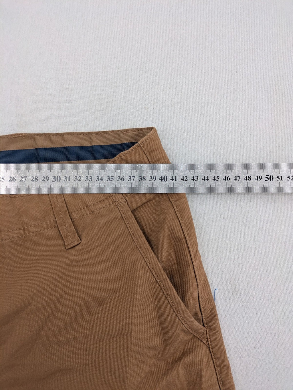 Nautical tan chino pants straight fit cotton blend with subtle anchor print lining.