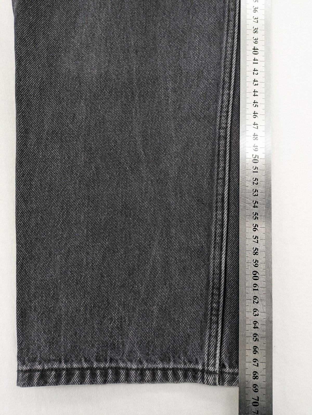 Weekday grey straight jeans with button fly and classic denim design.