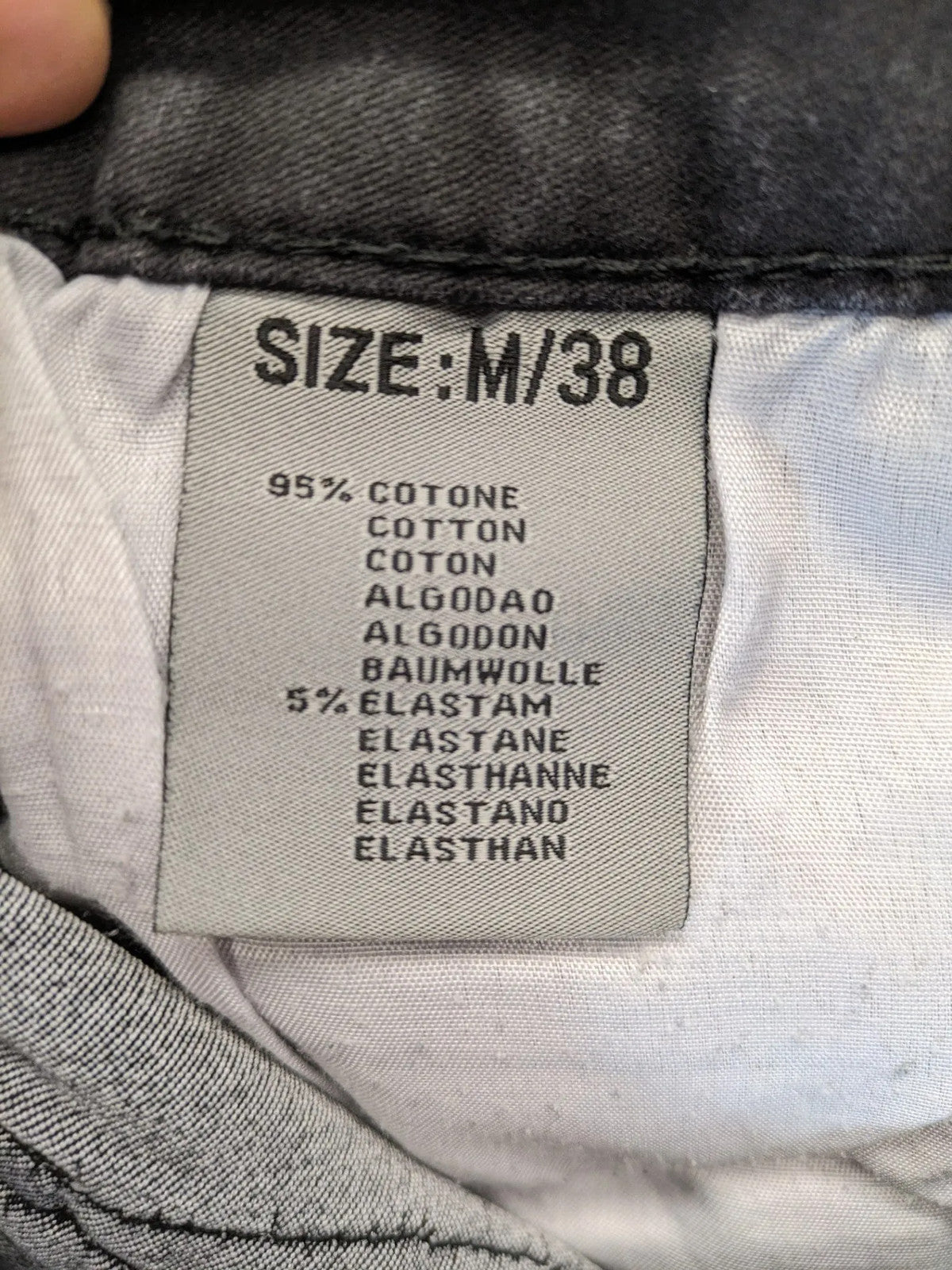 L & K Kaha black straight jeans with rhinestone logo patch and classic 5-pocket design.
