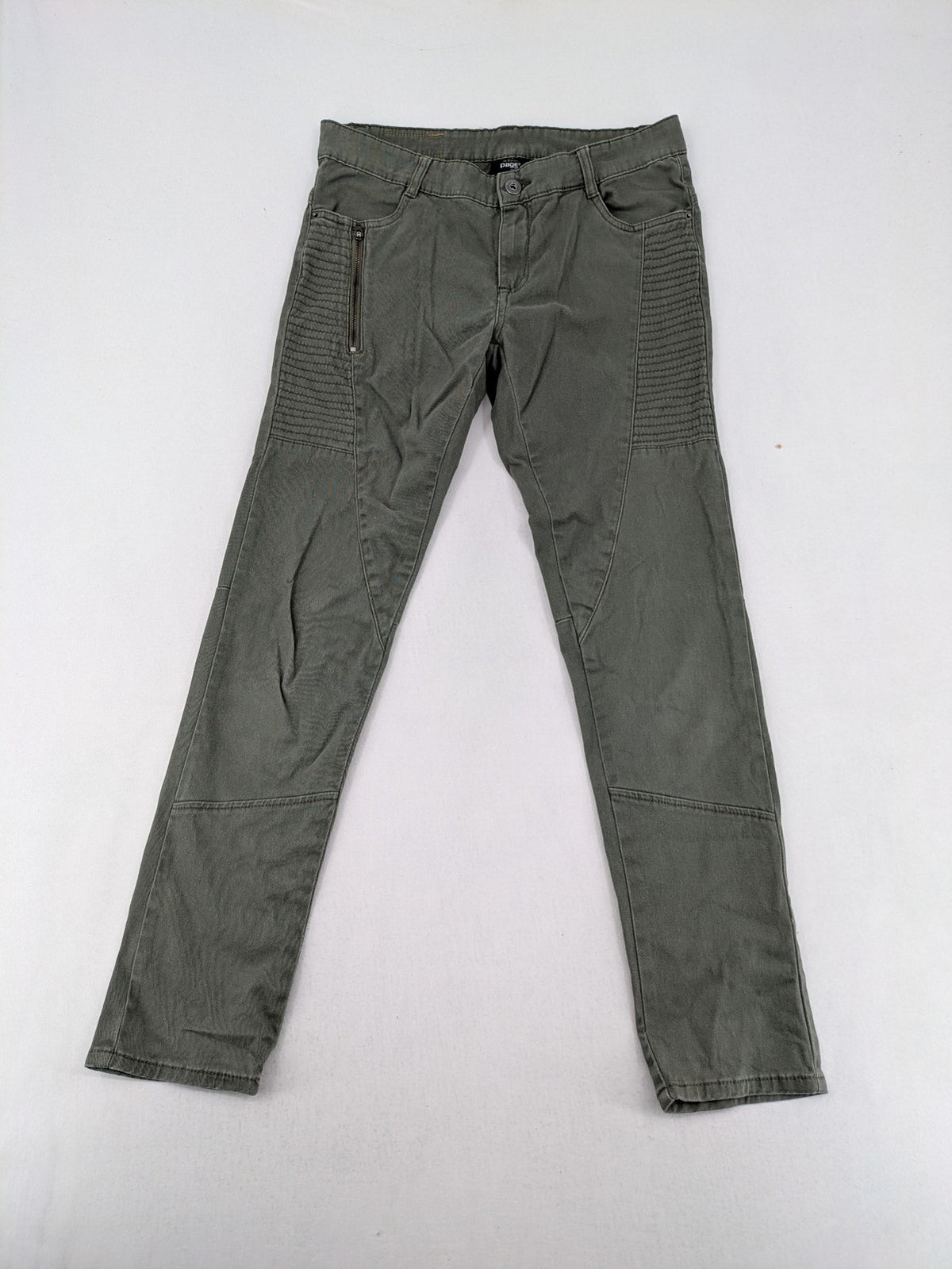 Page One Young khaki motorcycle pants with stitched panels and decorative zipper details.
