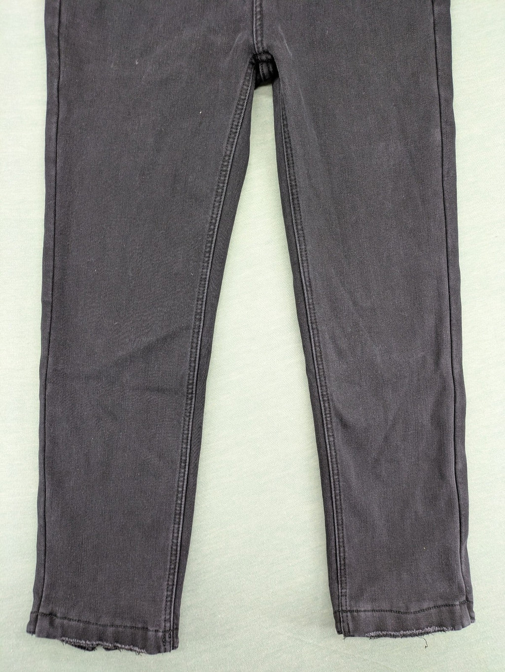 Disney black straight jeans with Minnie Mouse detail, cropped length, stretchy cotton blend.