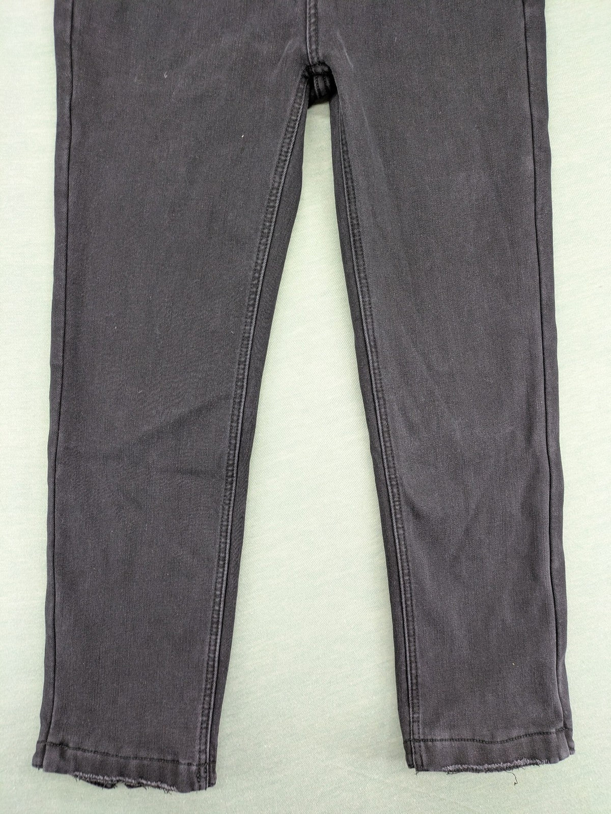 Disney black straight jeans with Minnie Mouse detail, cropped length, stretchy cotton blend.