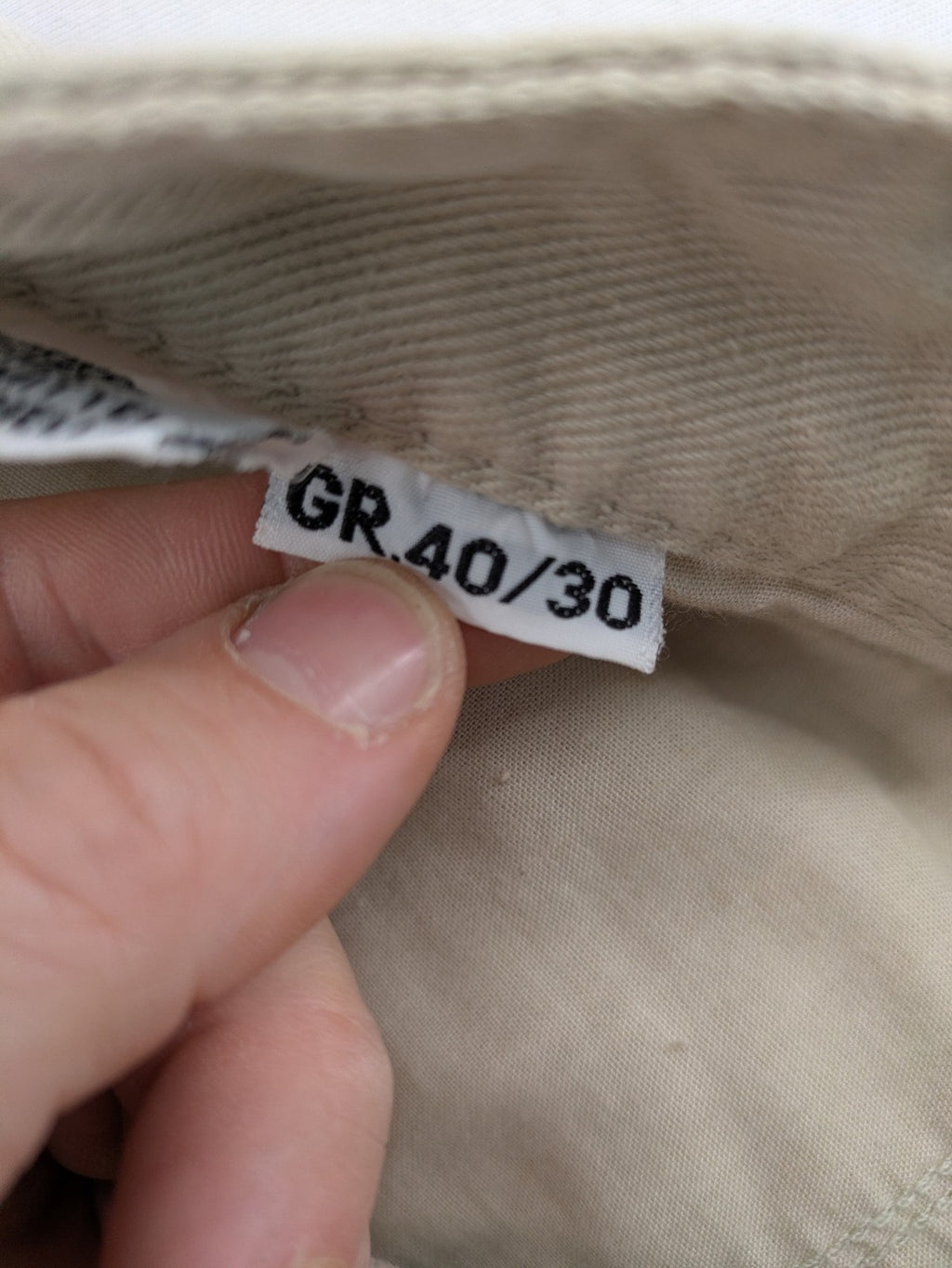 Joker beige straight jeans 5-pocket design with zipper and button closure.