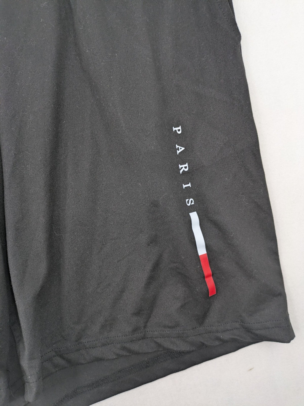 Manfinity loungewear set black T-shirt and shorts with Paris graphic print.