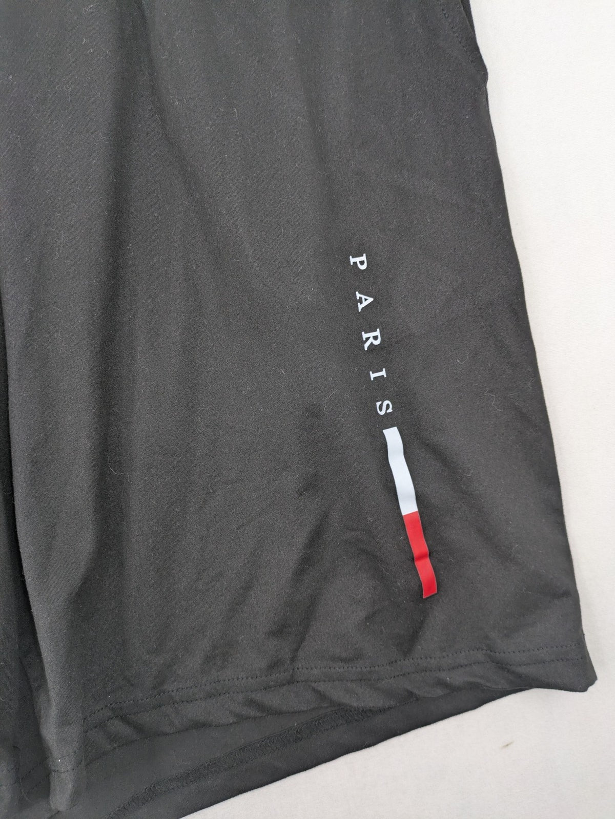 Manfinity loungewear set black T-shirt and shorts with Paris graphic print.