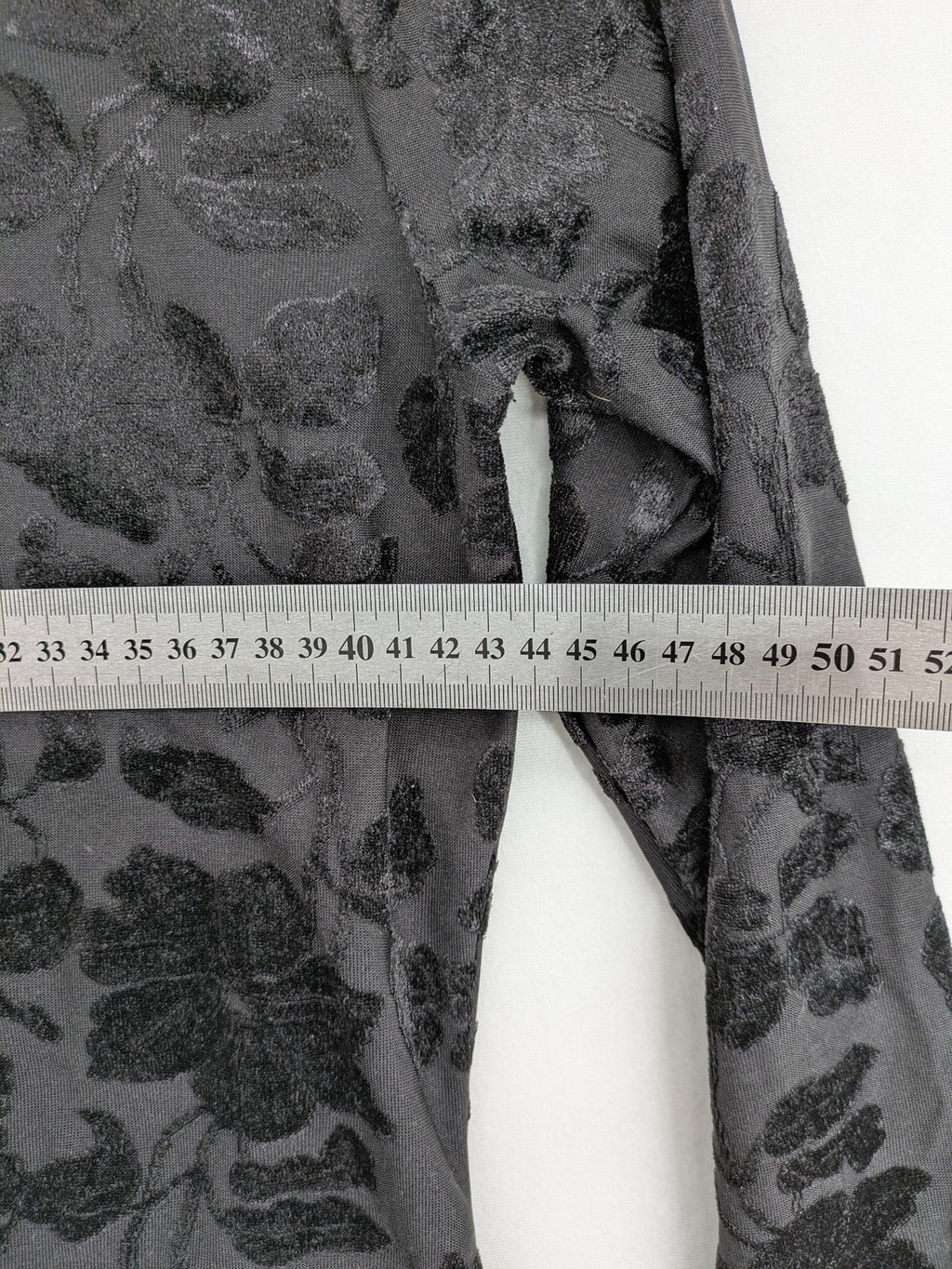 TCM black long sleeve top with floral flock print on sheer fabric.