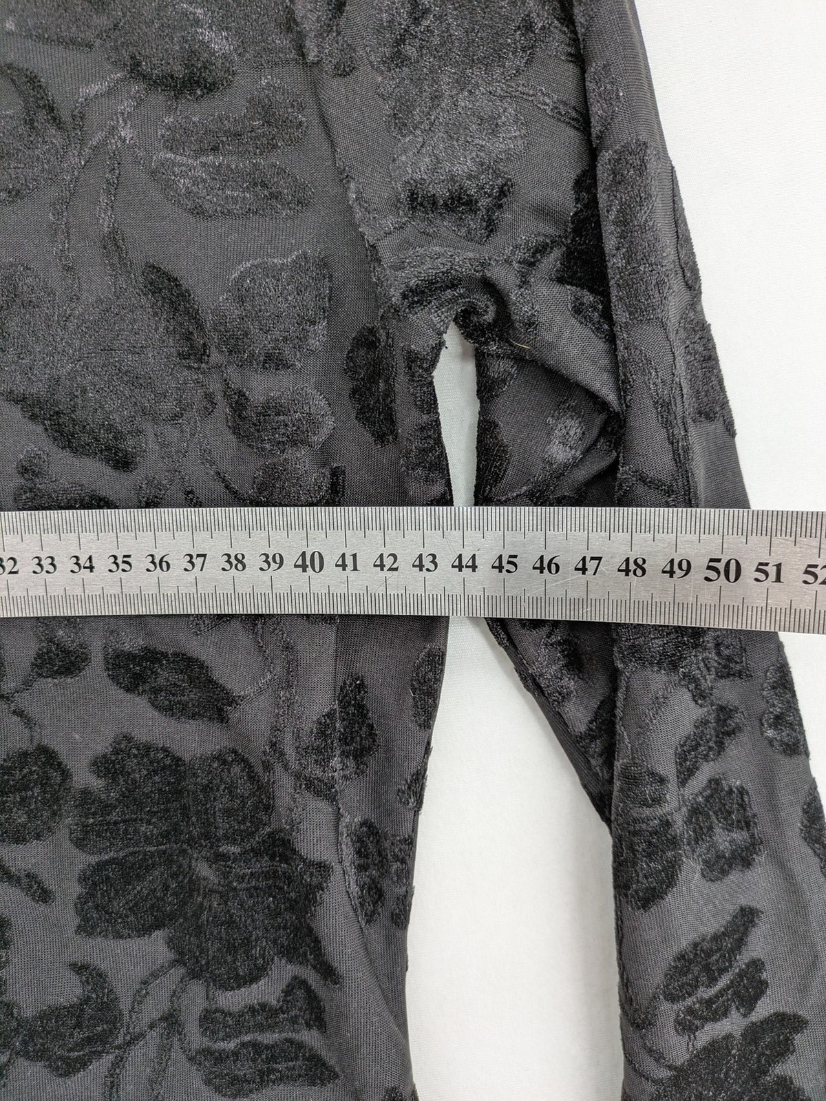 TCM black long sleeve top with floral flock print on sheer fabric.