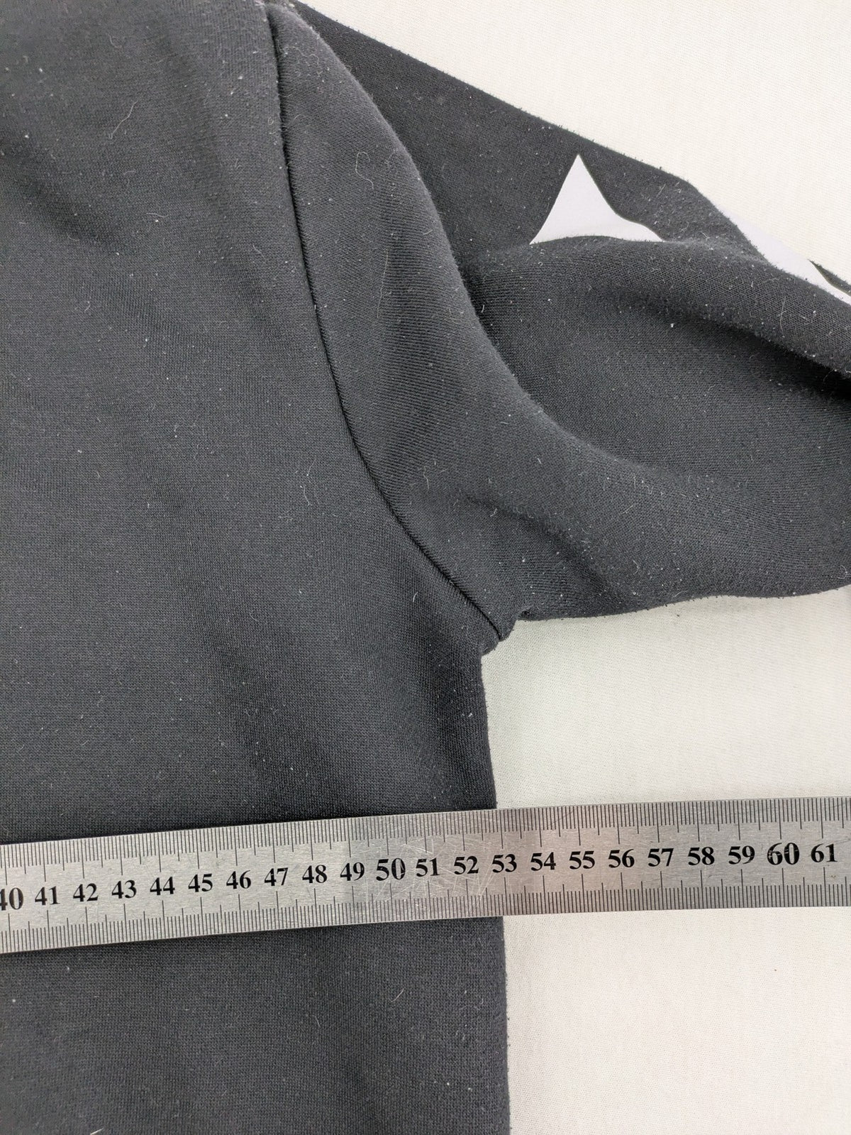 Off-White white zip-through hoodie with diagonal stripes and large arrows graphic.