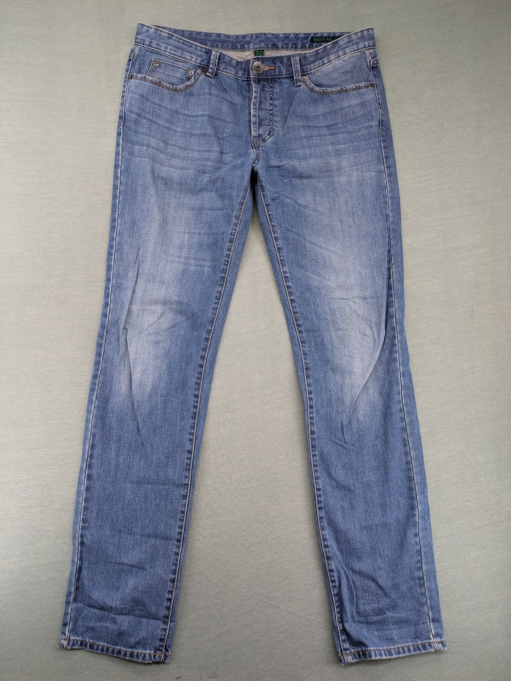 Benetton Jeans blue straight leg denim with button fly and classic design.