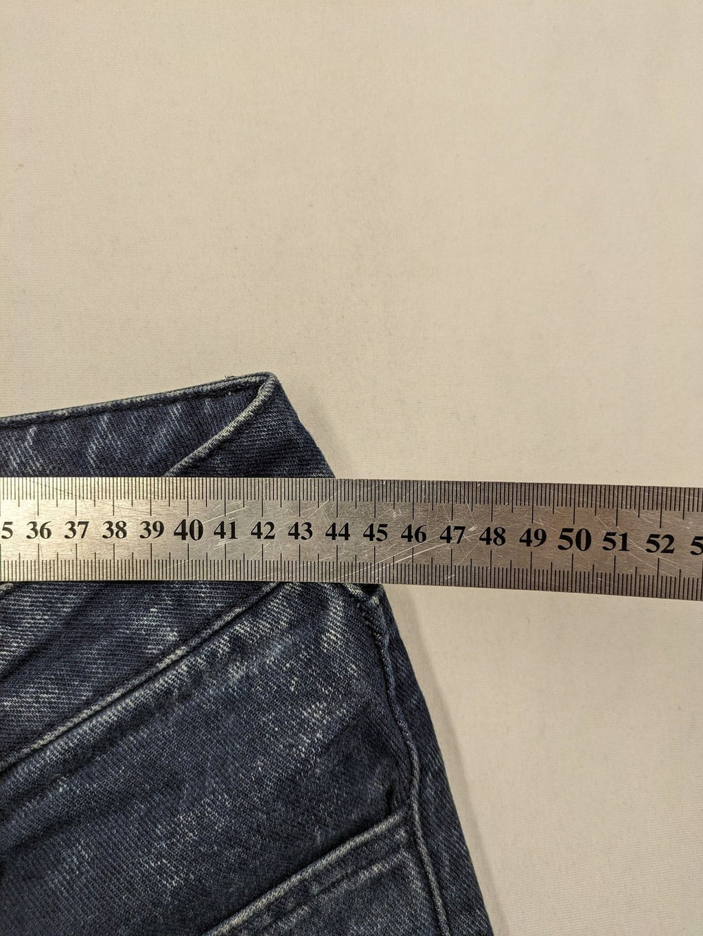 Reternity straight jeans blue black patchwork design with distressed details and frayed seams.