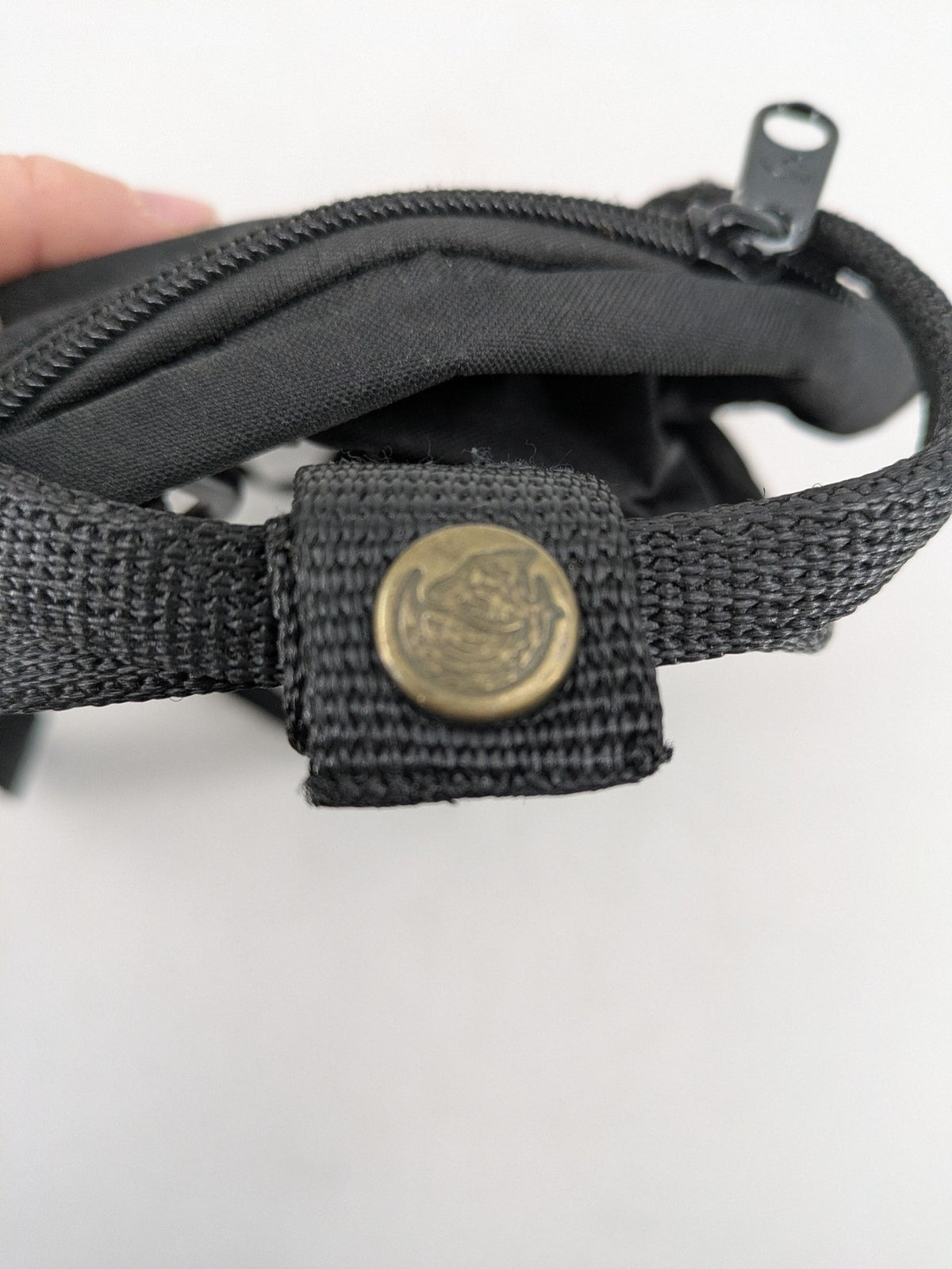 Fjällräven Kånken Mini rucksack black durable fabric with logo and zippered main compartment.