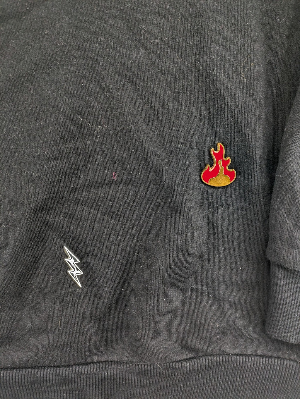Zara grey turtle neck jumper with skull, scorpion, flame, and eagle embellishments.