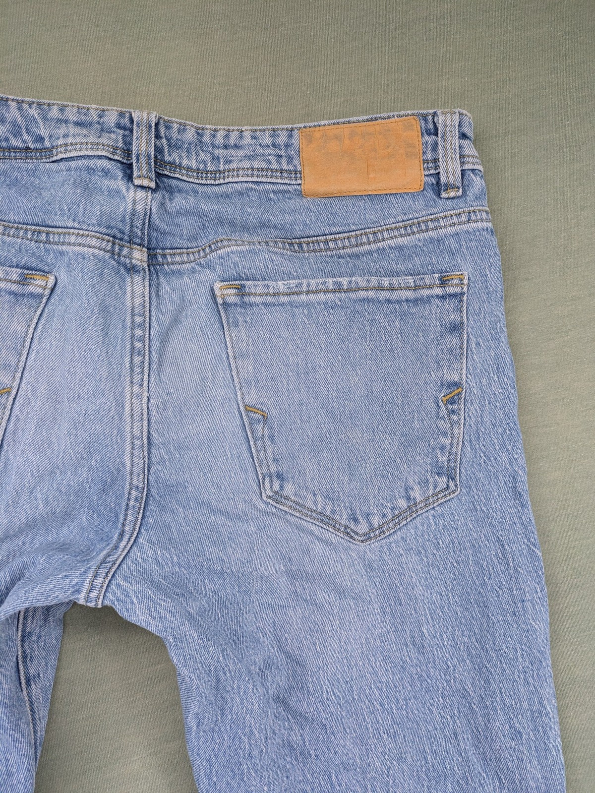 Selected Homme blue slim fit jeans with classic wash and stretch cotton material.
