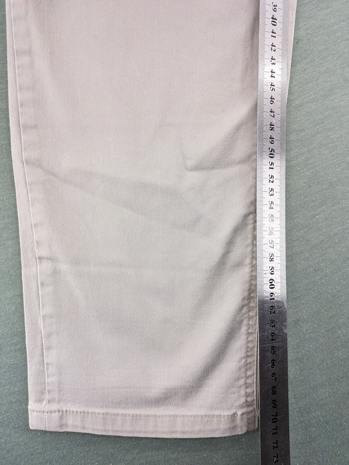 Canda beige straight jeans with strass details and classic five-pocket design.