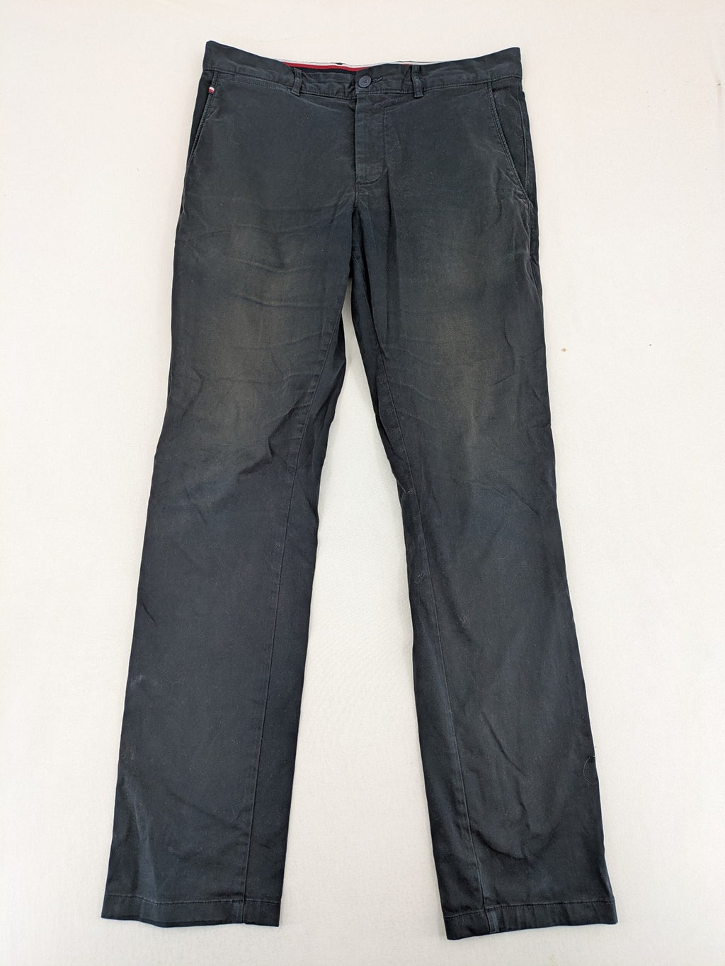 Tommy Hilfiger grey chino pants with TH-Flex stretch technology and classic straight fit design.