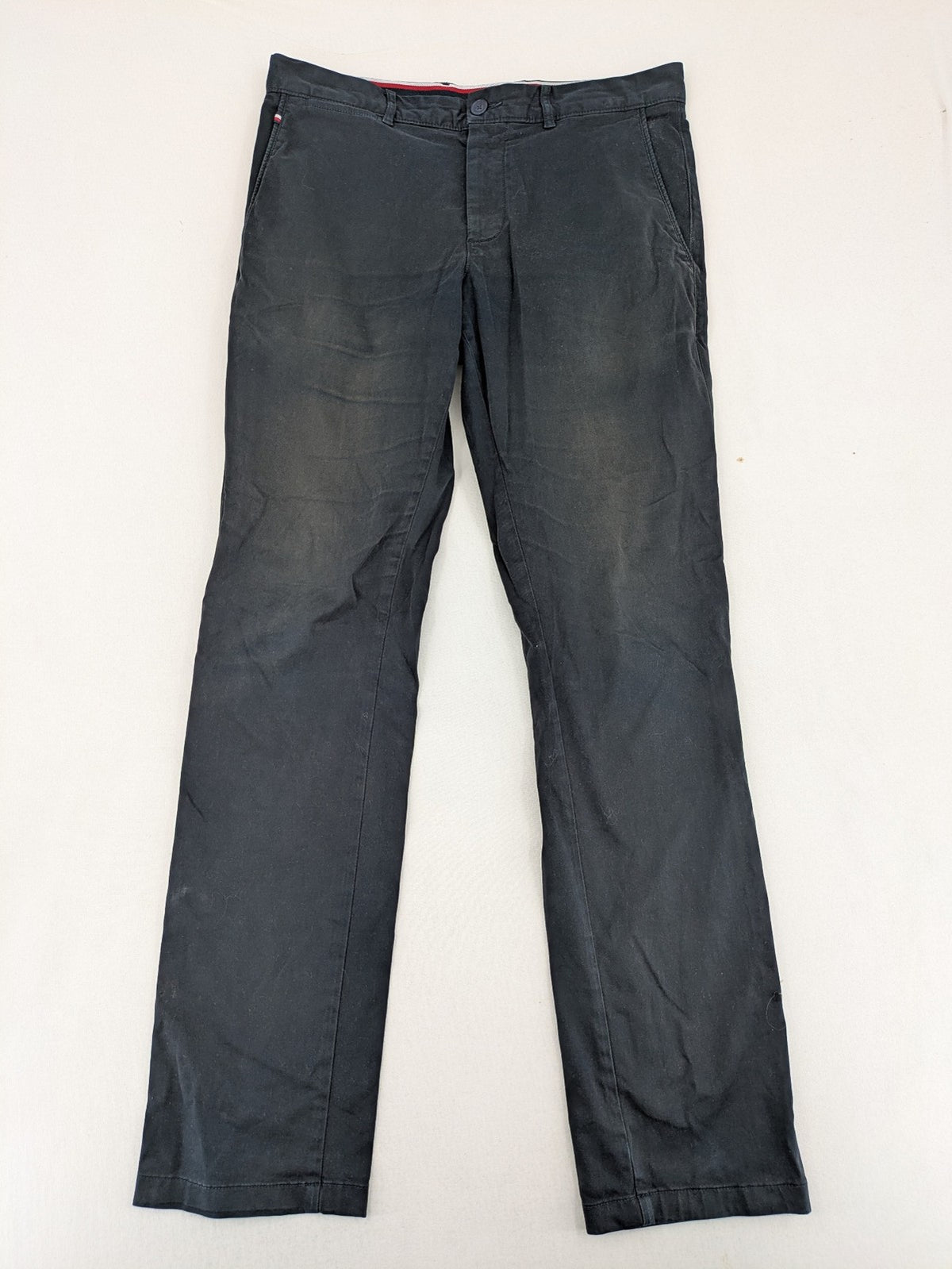 Tommy Hilfiger grey chino pants with TH-Flex stretch technology and classic straight fit design.