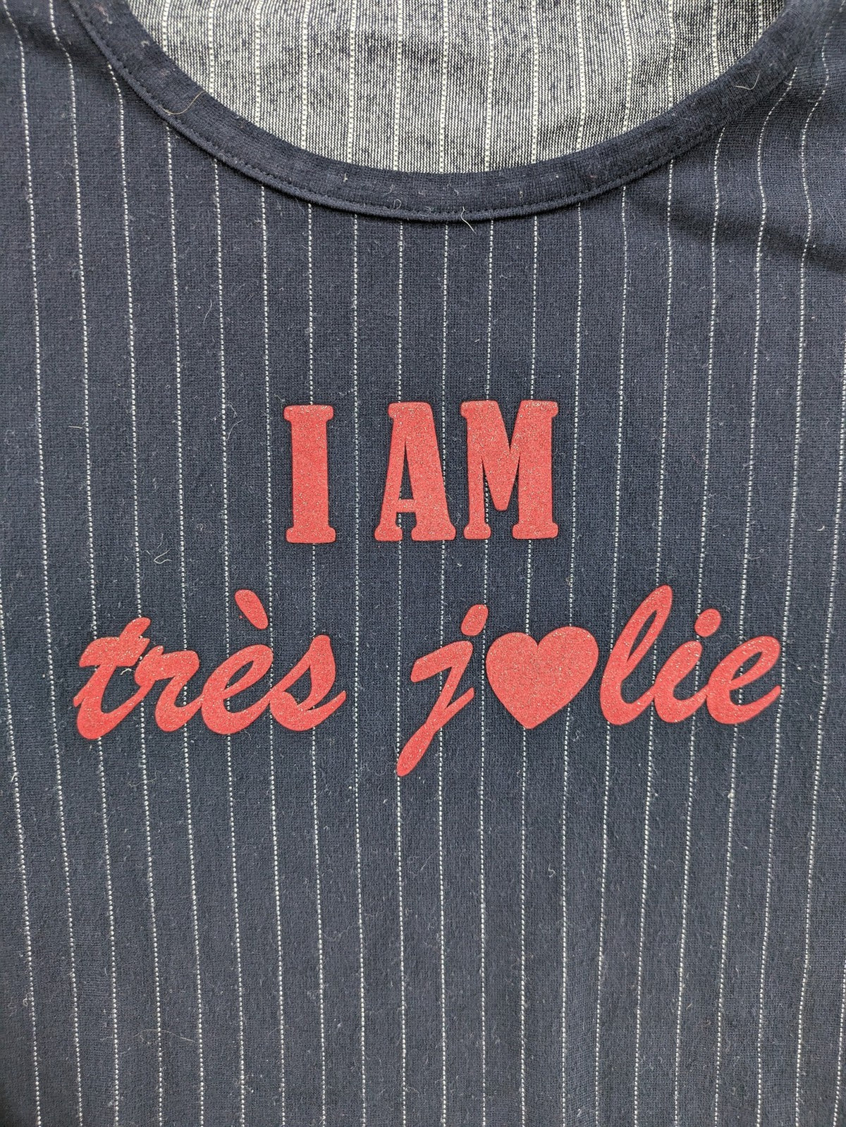 RIVER WOODS navy long sleeve top with white pinstripes and red "I AM très jolie" slogan.