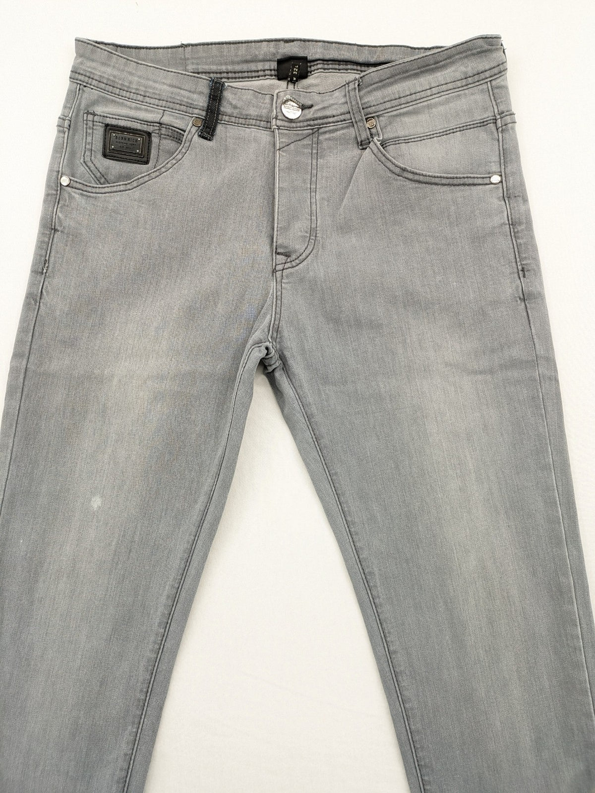 Born Rich grey slim fit jeans with logo patch and washed denim texture.
