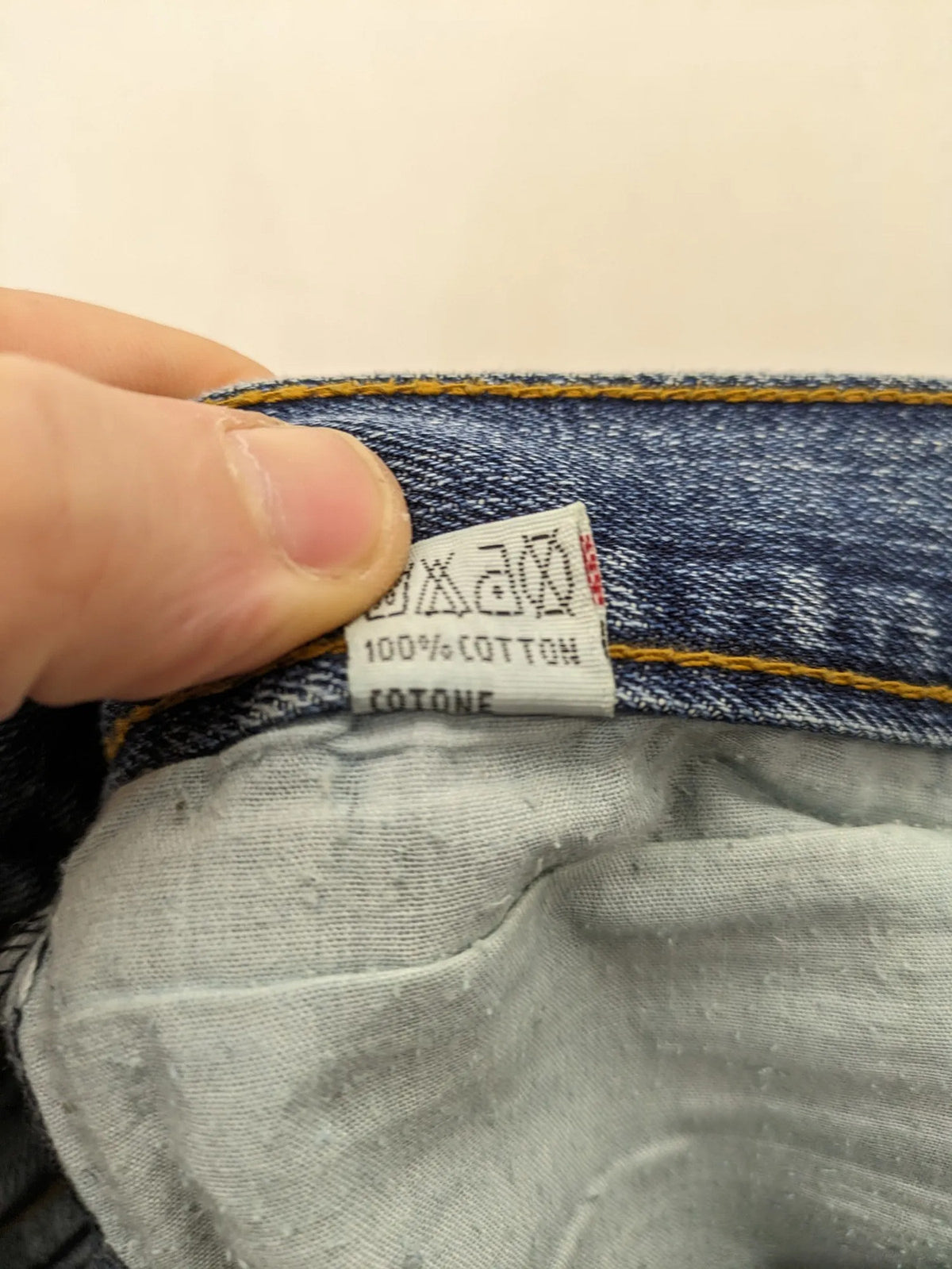 Zuni blue straight jeans 5-pocket design with zipper and decorative rivets.
