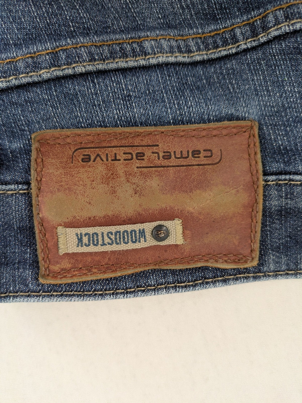 Camel Active blue straight jeans with classic 5-pocket design and logo patch.