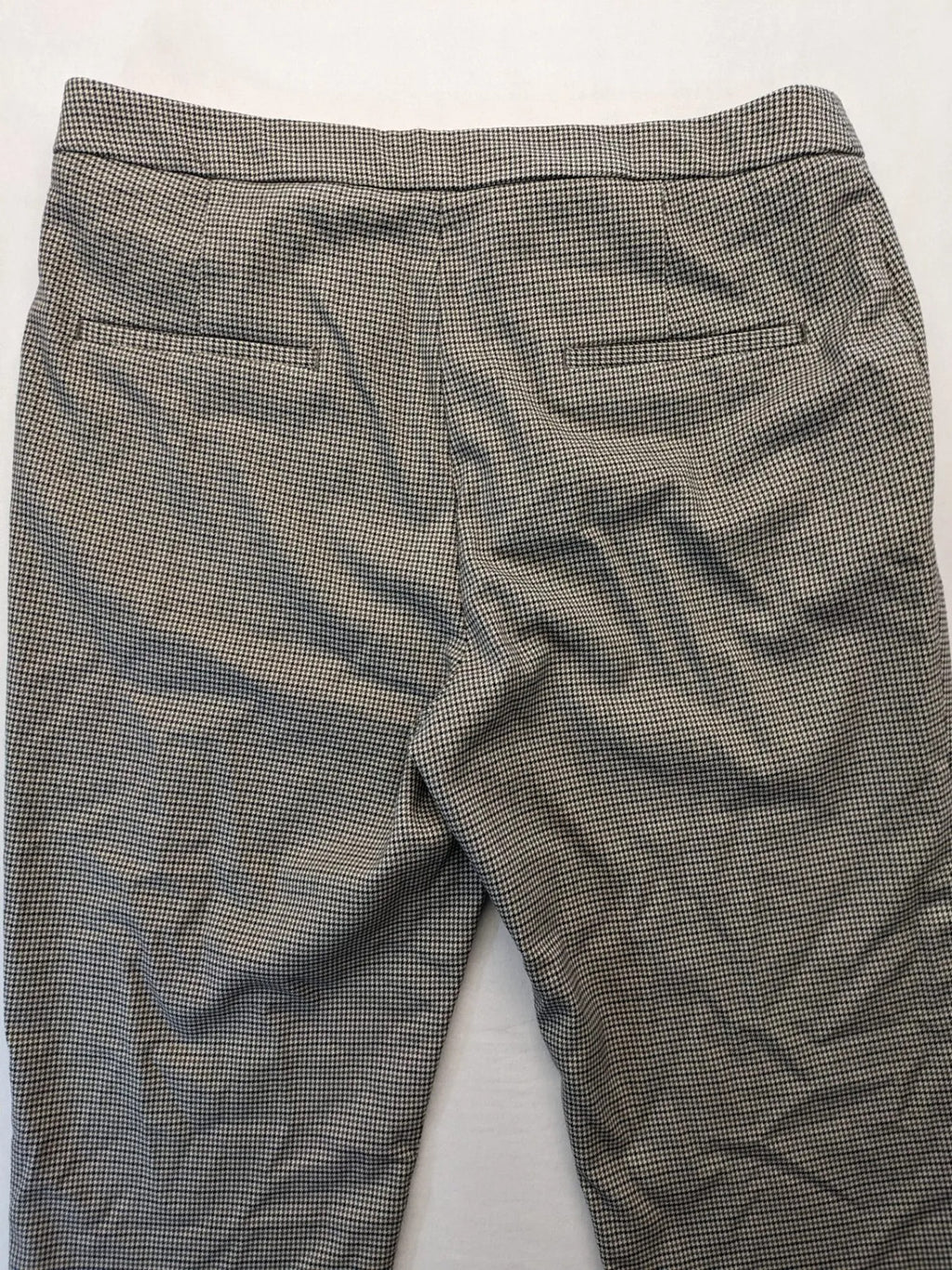 H&M beige pants houndstooth pattern with black and brown tones, stretchy material.