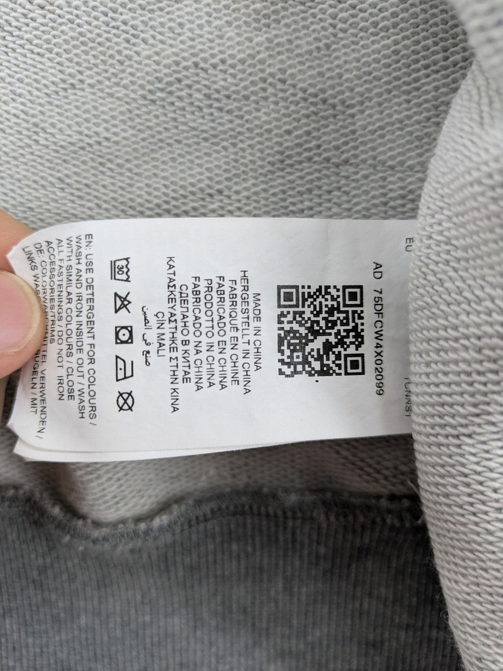 Puma grey full zip hoodie with adjustable drawstring hood and logo detail.