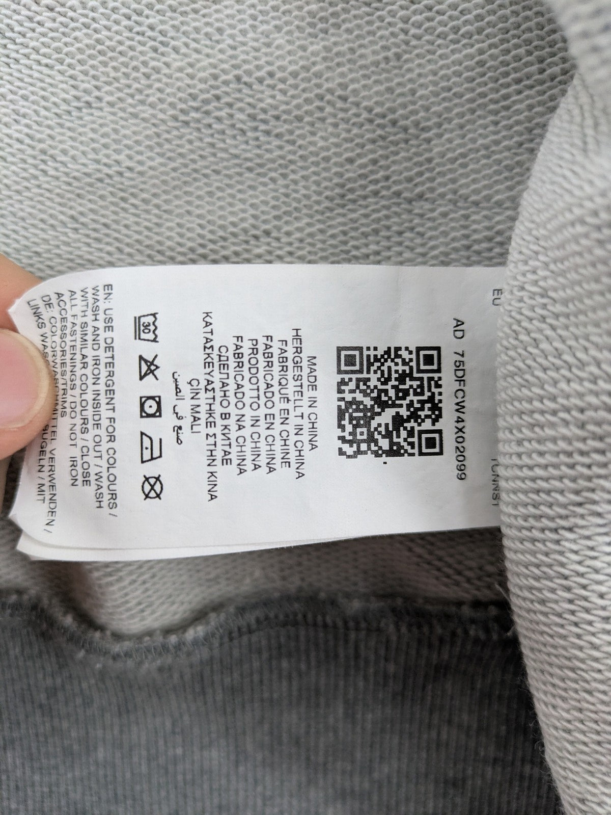 Puma grey full zip hoodie with adjustable drawstring hood and logo detail.