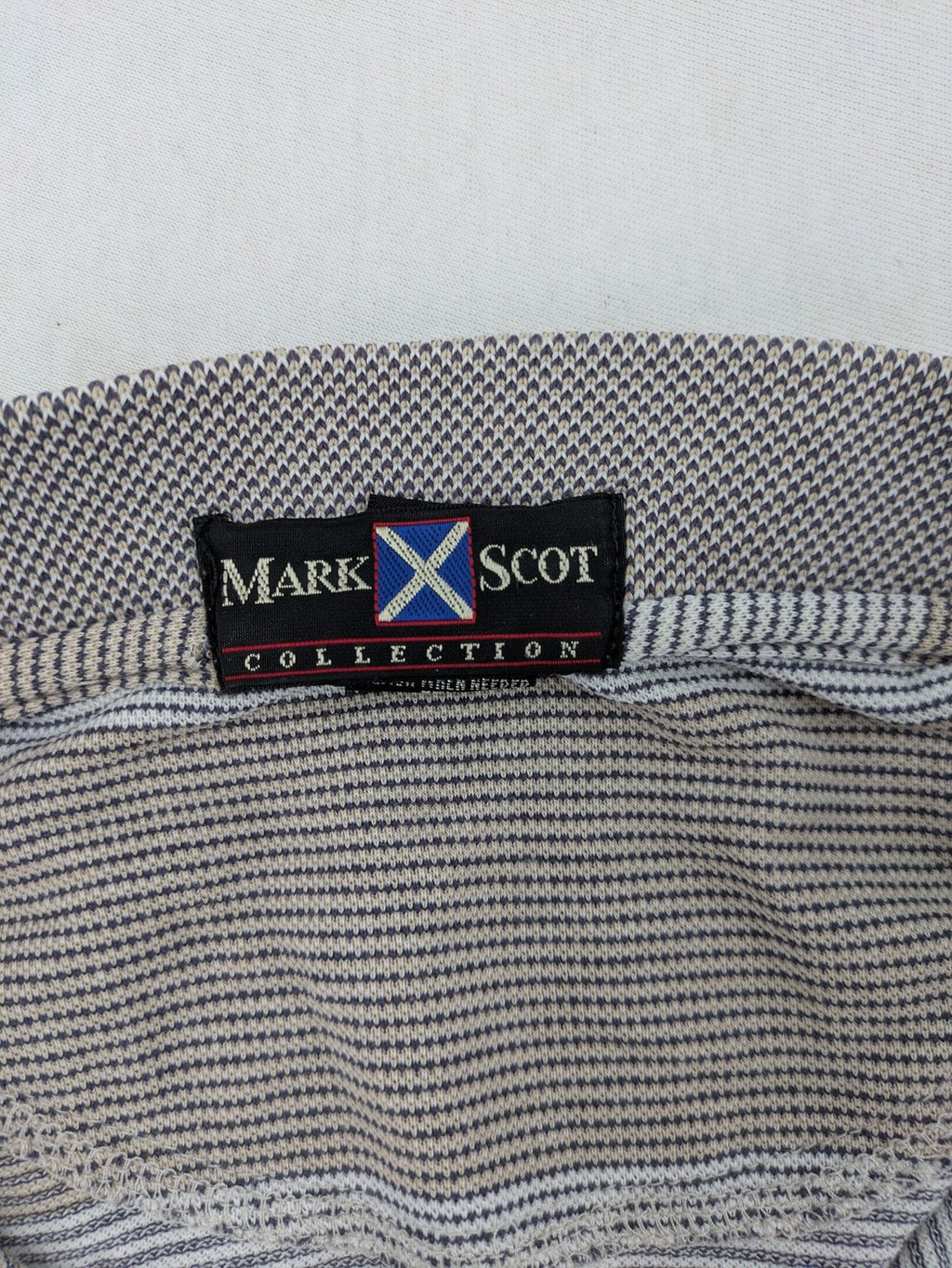 Mark Scot Collection grey and tan striped polo shirt with classic collar and logo.